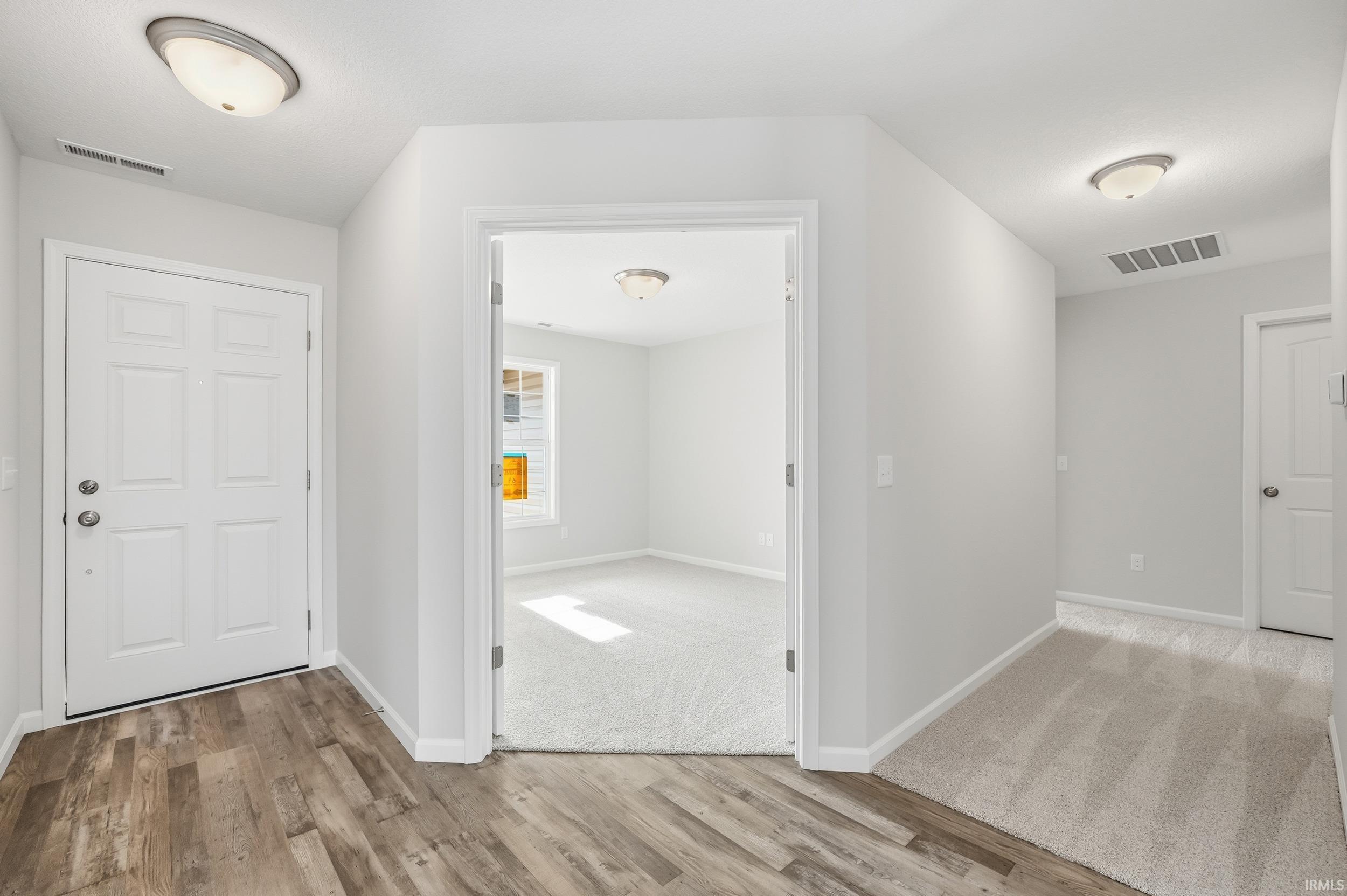 Foyer entrance featuring light wood-style flooring