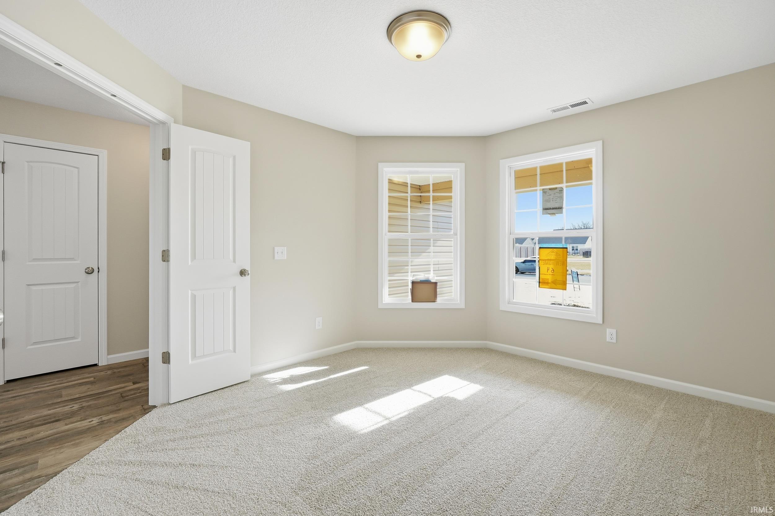 Empty room featuring baseboards