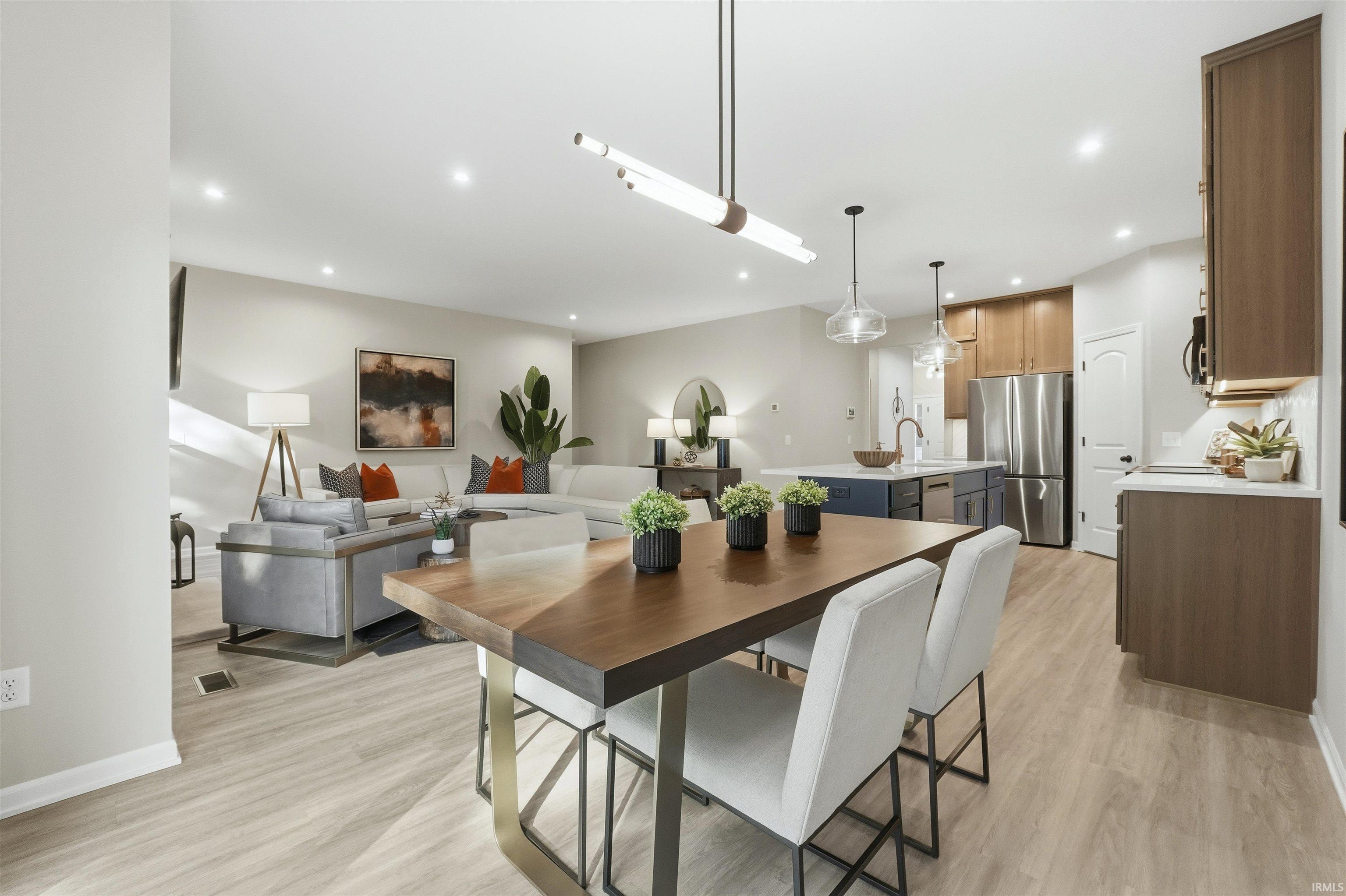 Dining space featuring light wood-type flooring and recessed lighting