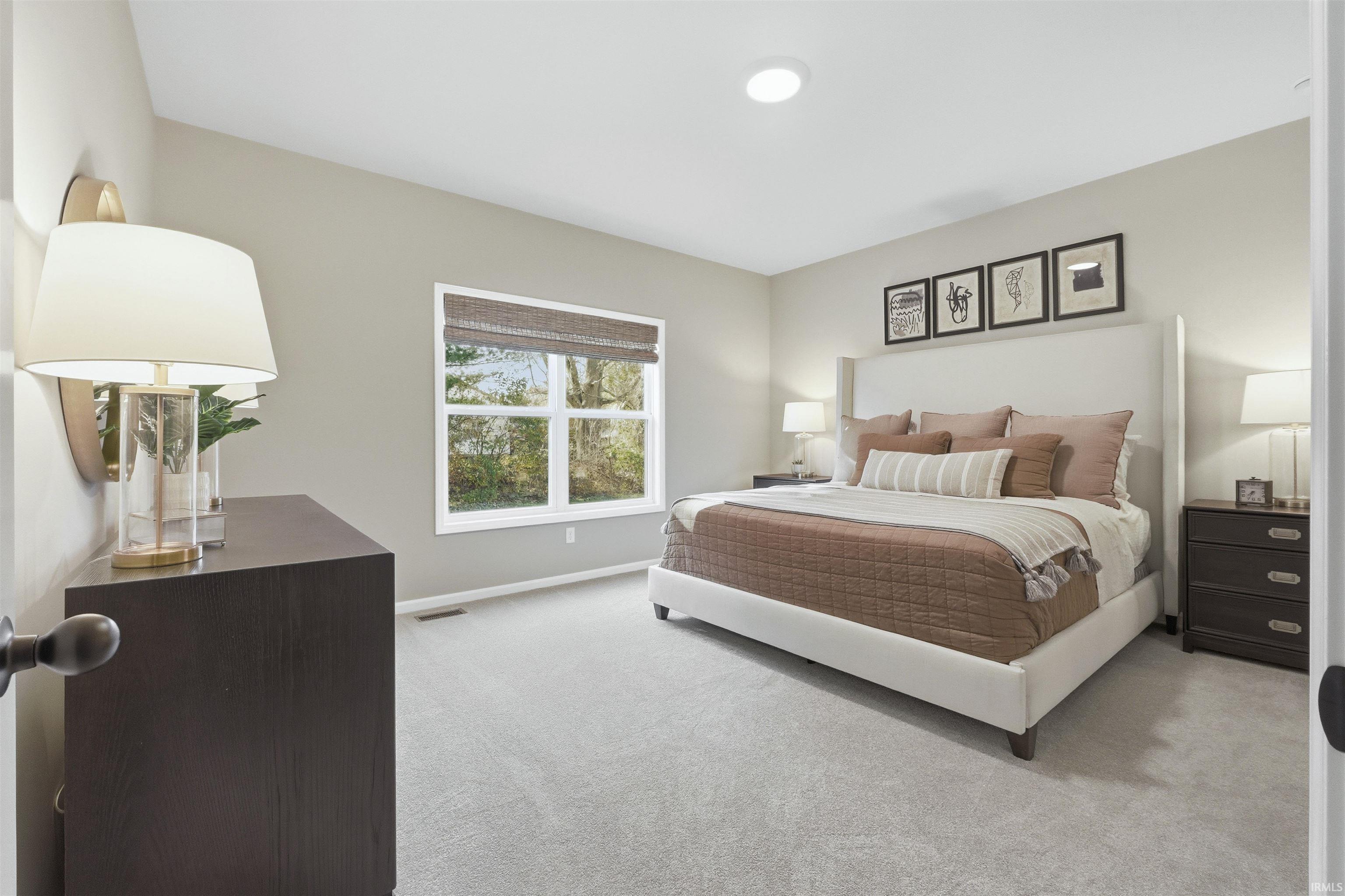 Owner Suite Bedroom featuring carpet floors and baseboards