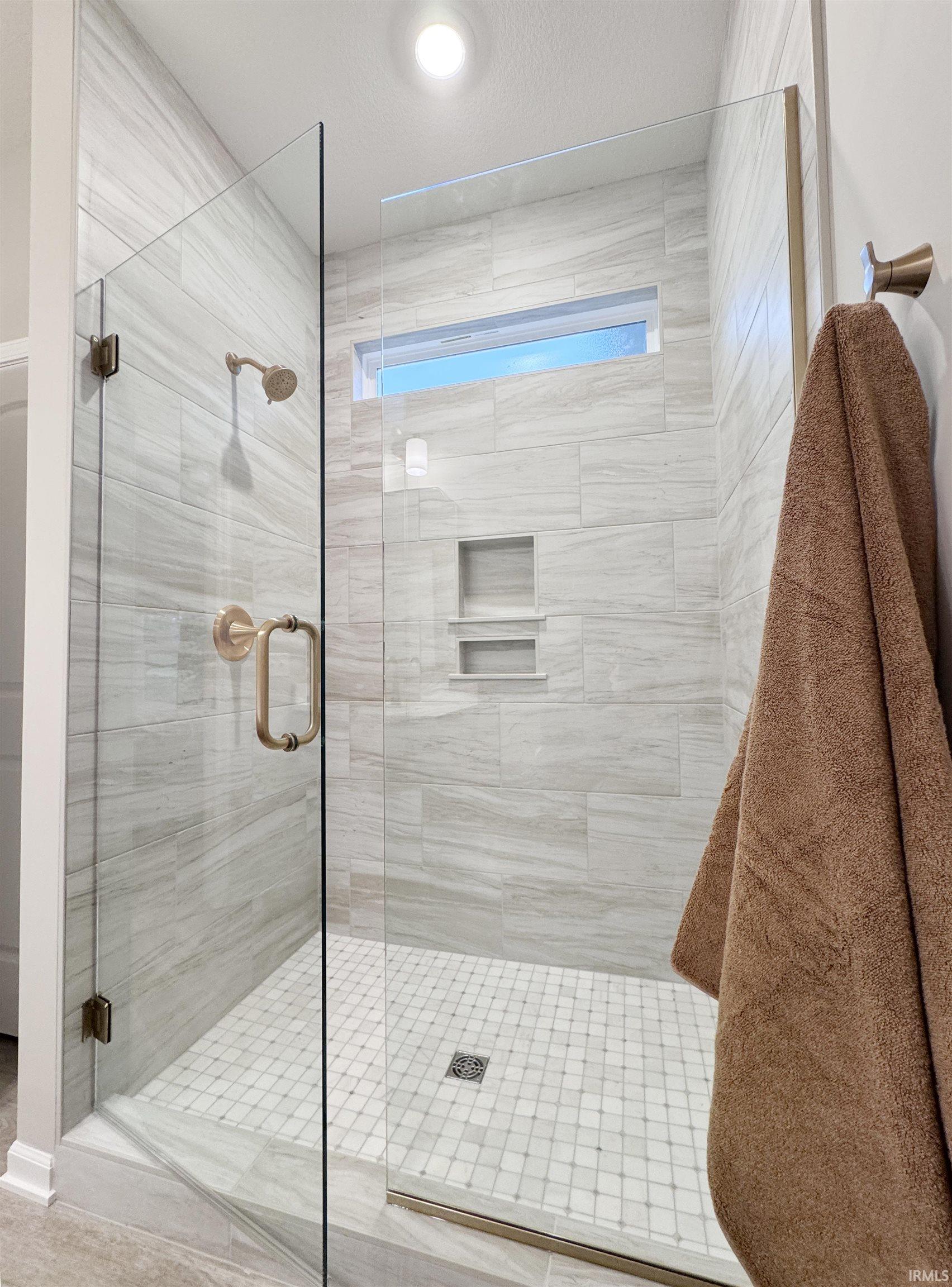 Owner Suite Bathroom featuring a ceramic shower