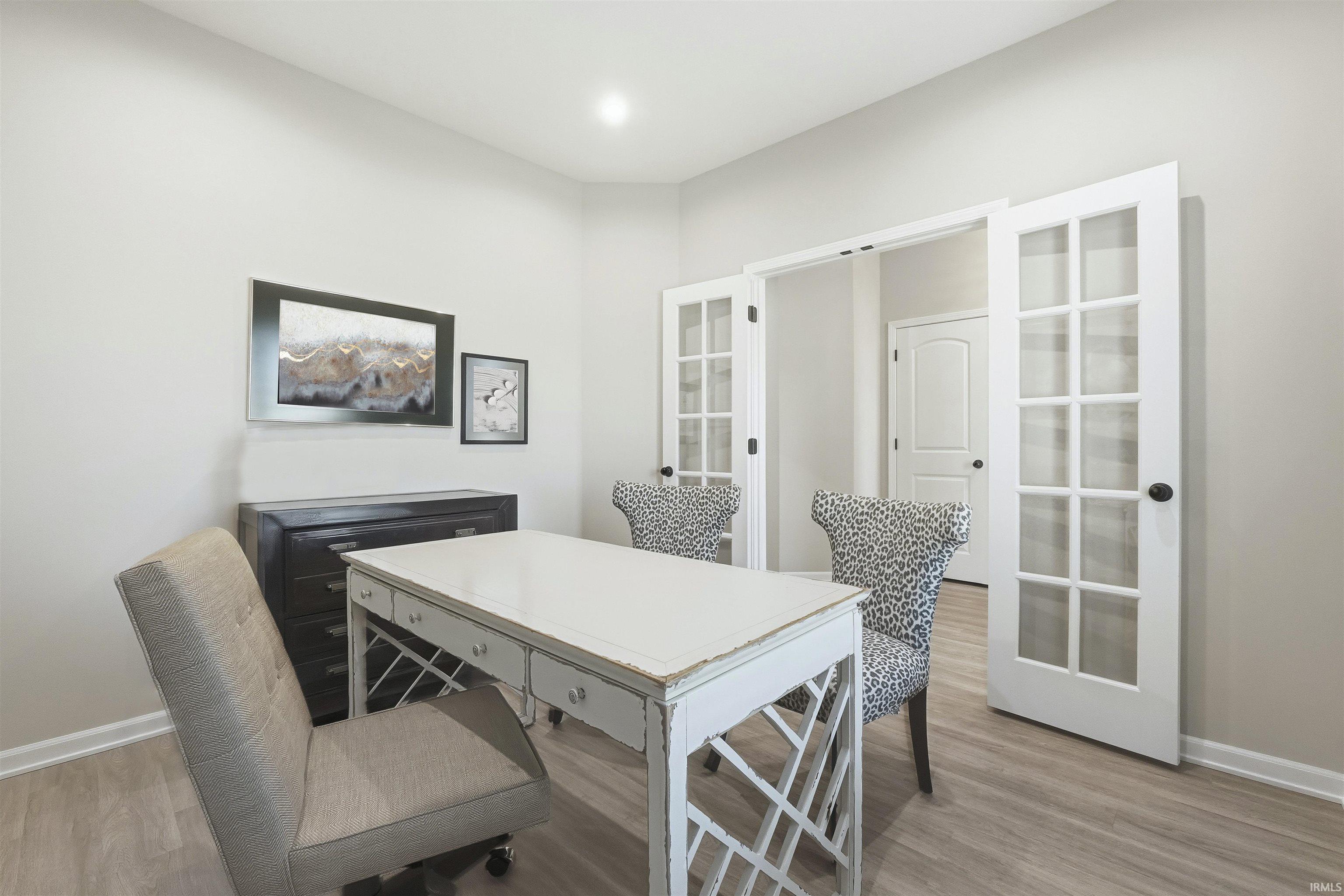 Office featuring french doors and light wood finished floors