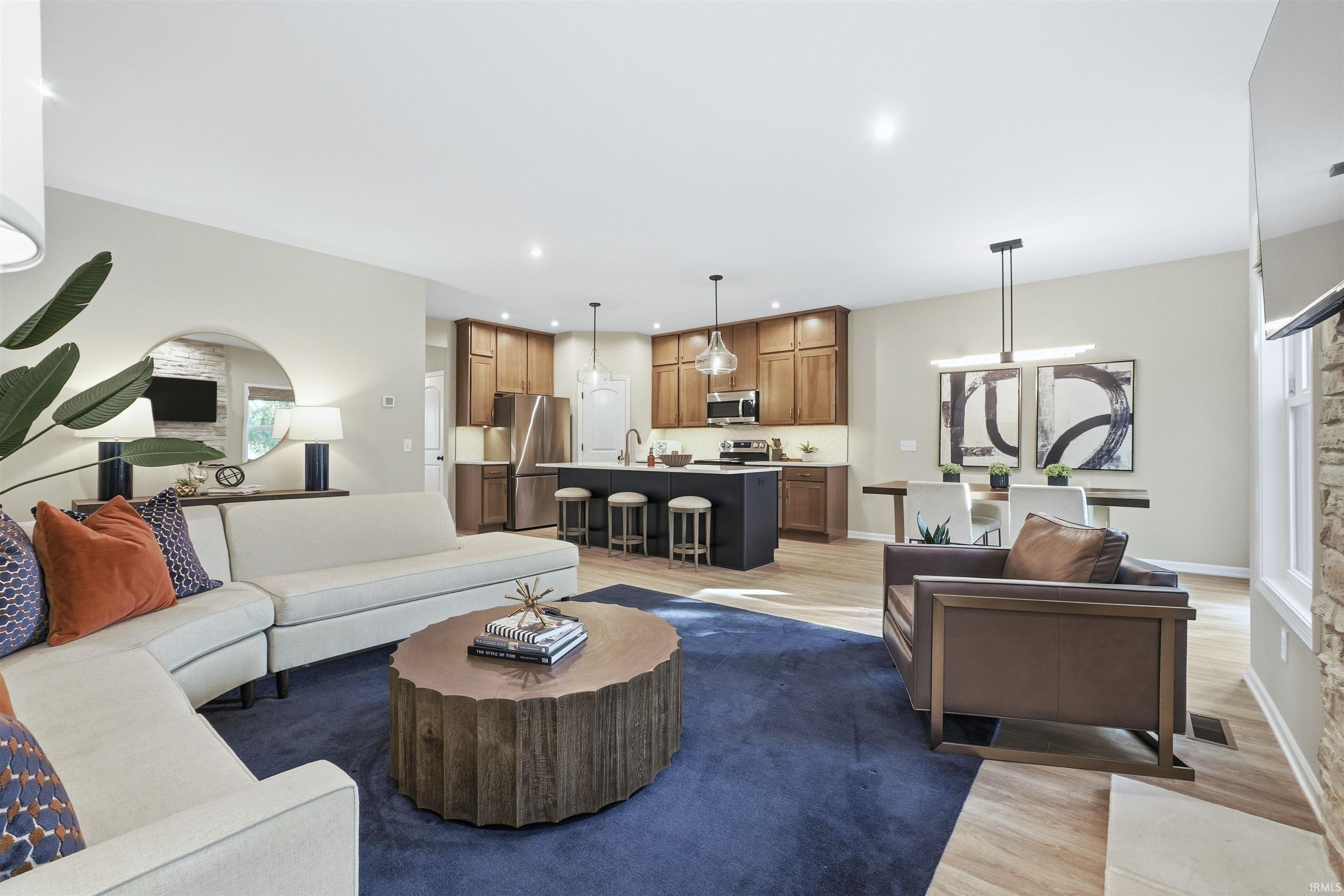 Great Room with light wood-type flooring and recessed lighting