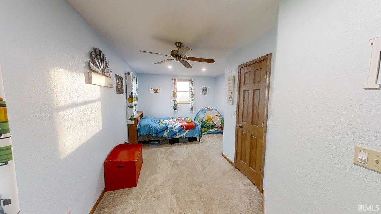 Upstairs Bedroom featuring light carpet, ceiling fan, and recessed lighting