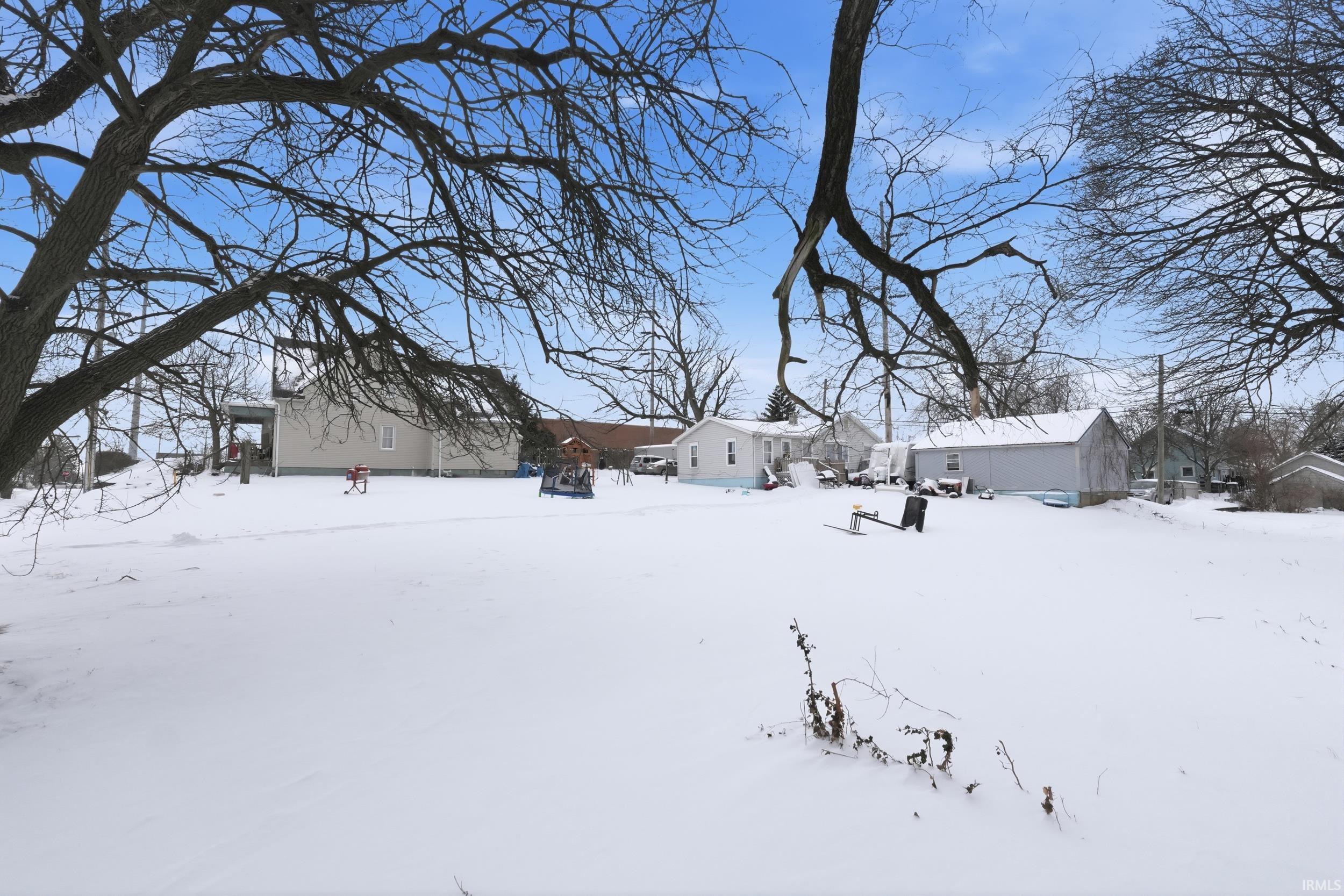 View of yard covered in snow