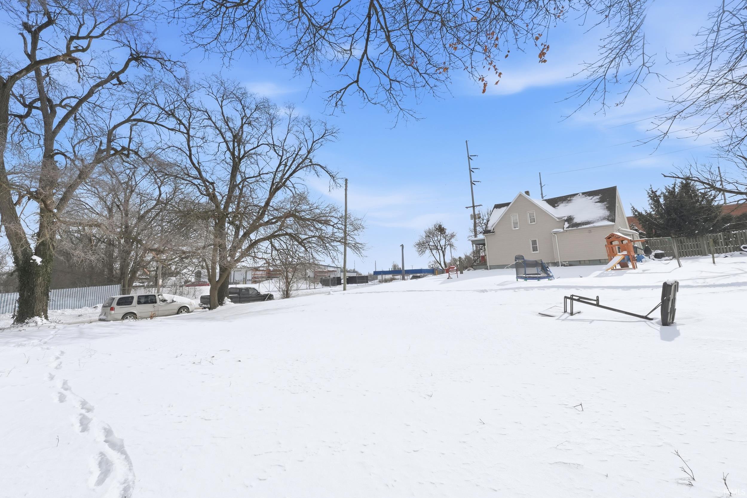 View of yard covered in snow