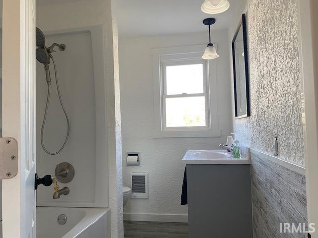 Completely remodeld to studs with new tub/shower combo, vanity, toilet, vinyl pland laminate flooring and accent wall.