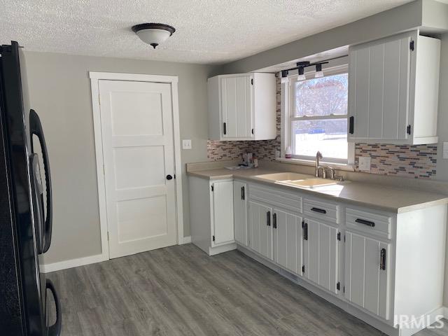 Repainted kitchen cabinters with updated hardware.