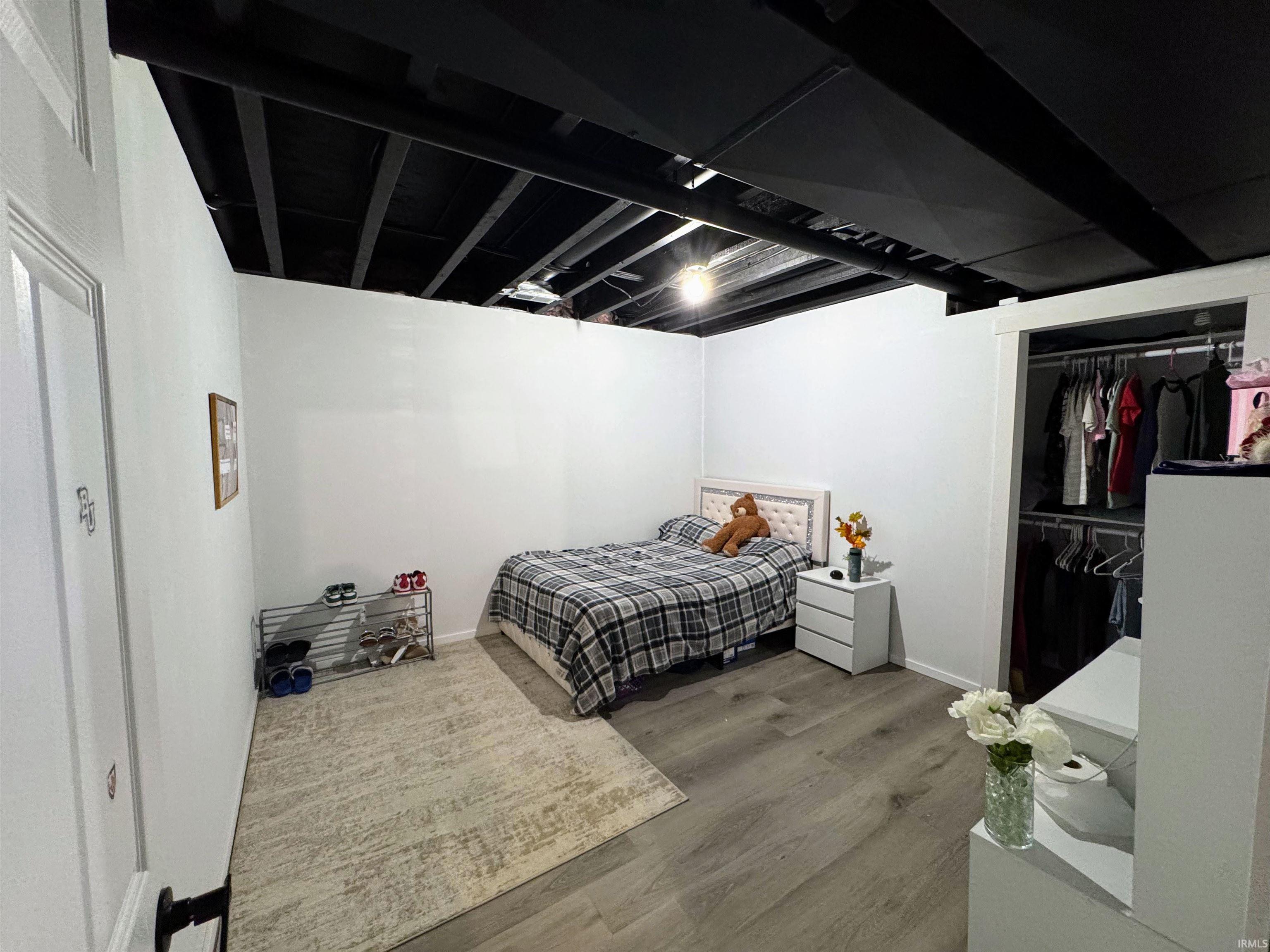 Bedroom featuring a closet and wood finished floors