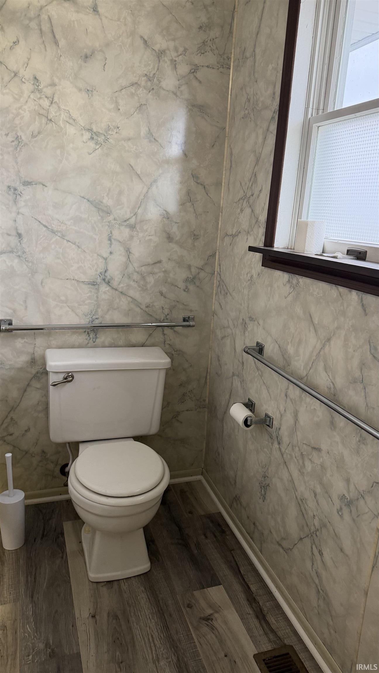 Bathroom with vinyl floors and toilet