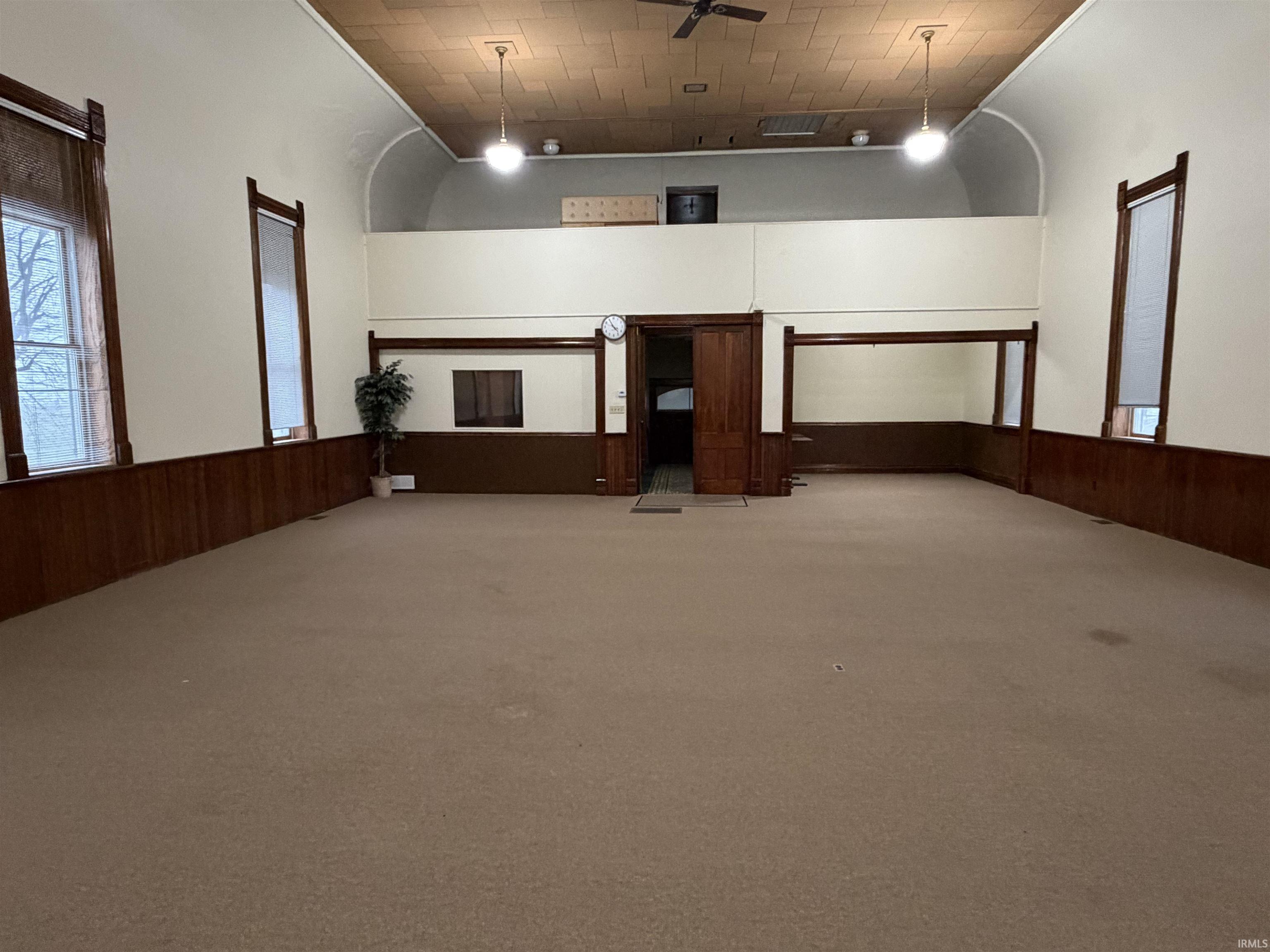 Garage with wainscoting and wooden walls