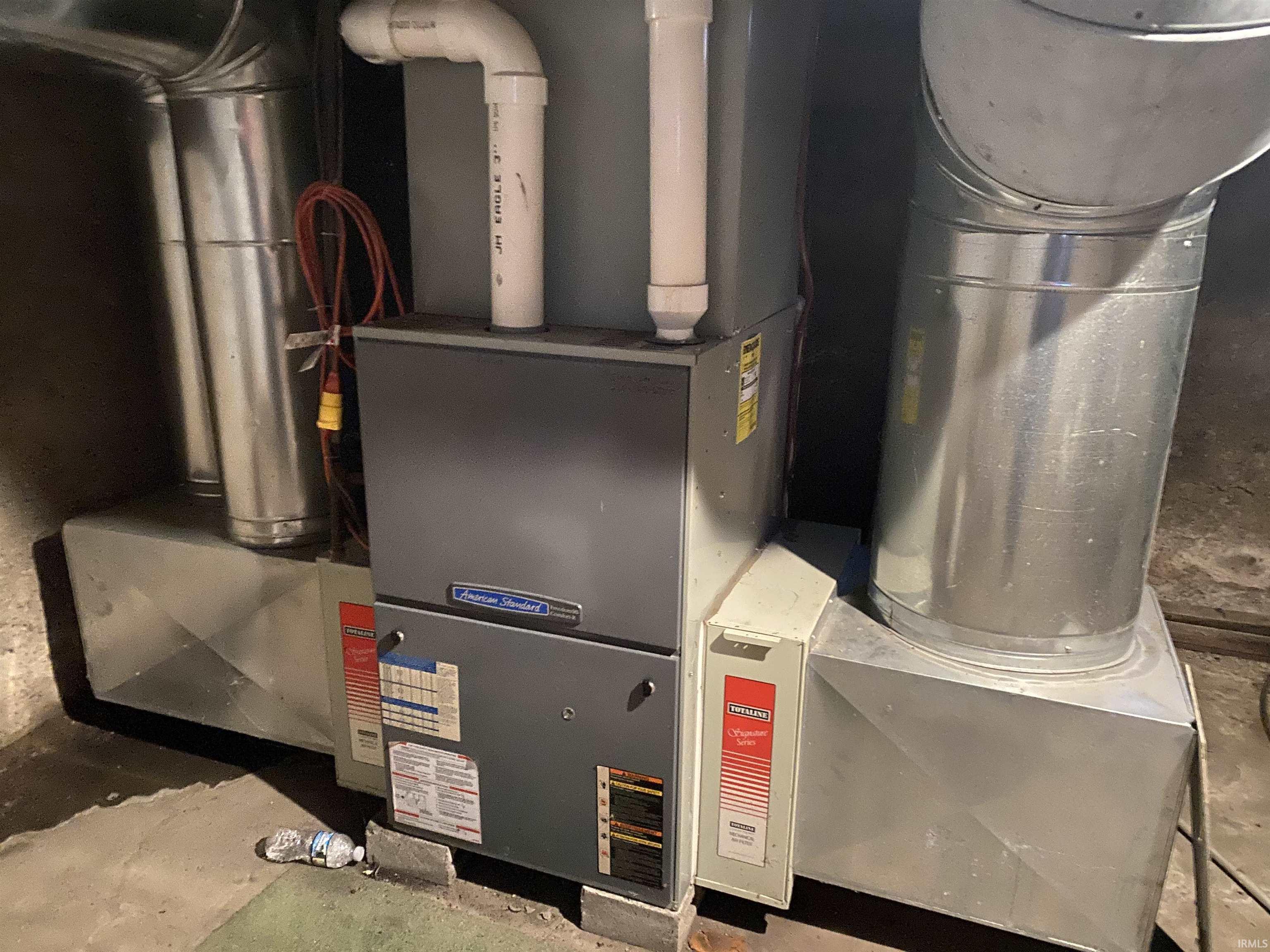 Utility room featuring heating unit