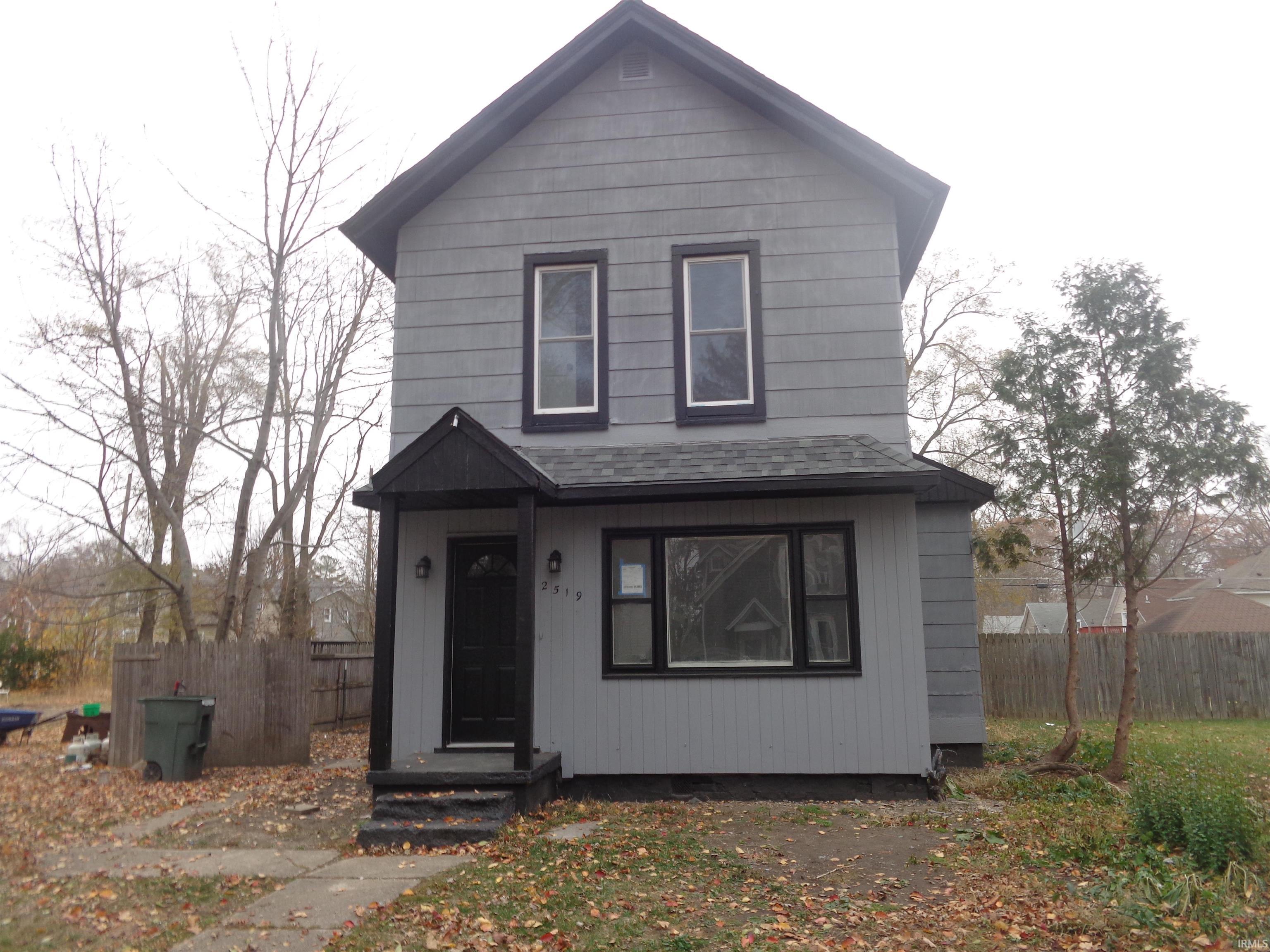 View of front facade with roof with shingles
