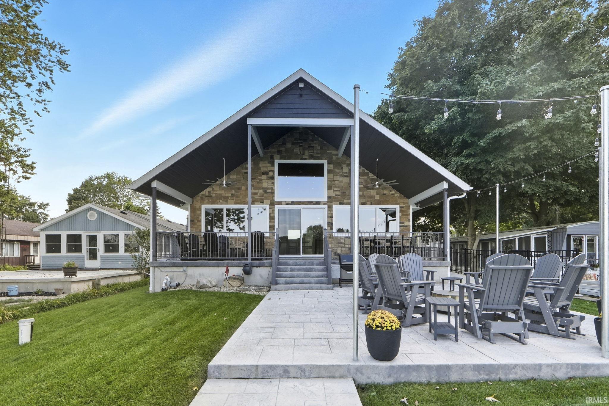View of property's community featuring a patio, a yard, and a deck