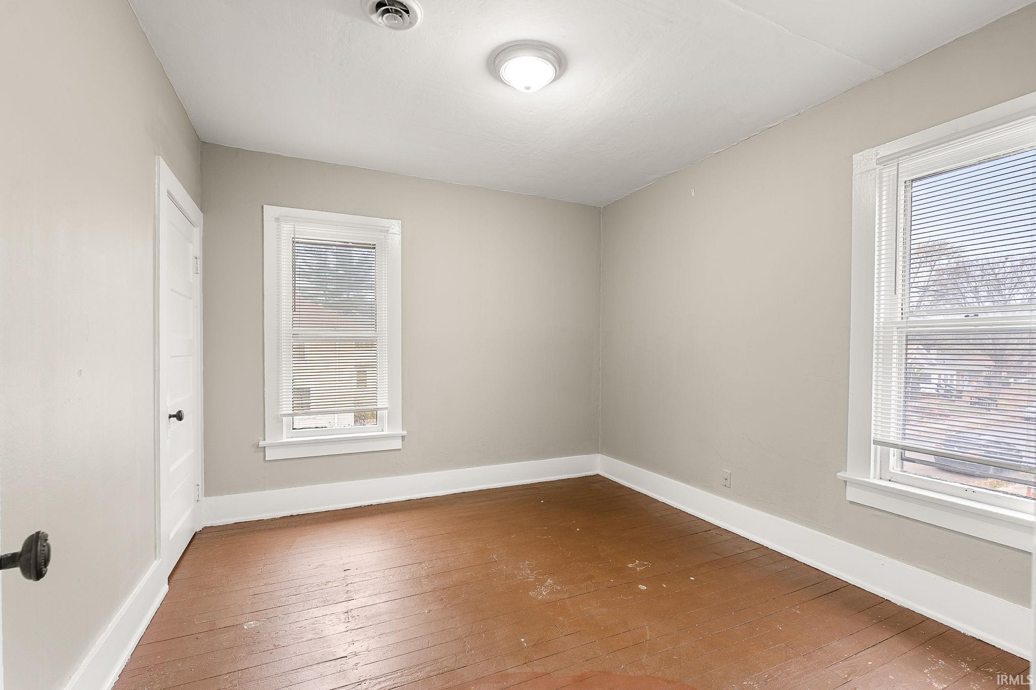 Unfurnished room with wood-type flooring