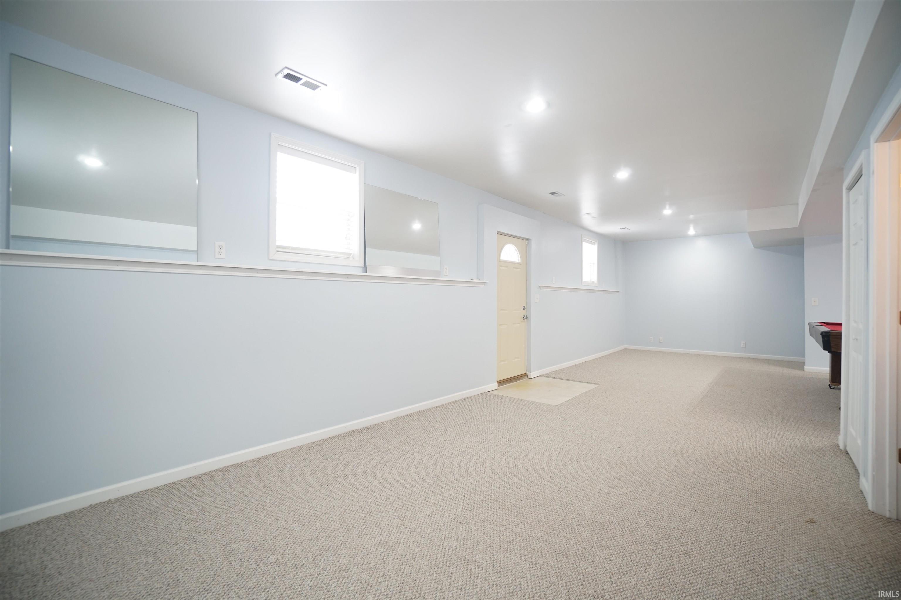 Basement with carpet and recessed lighting