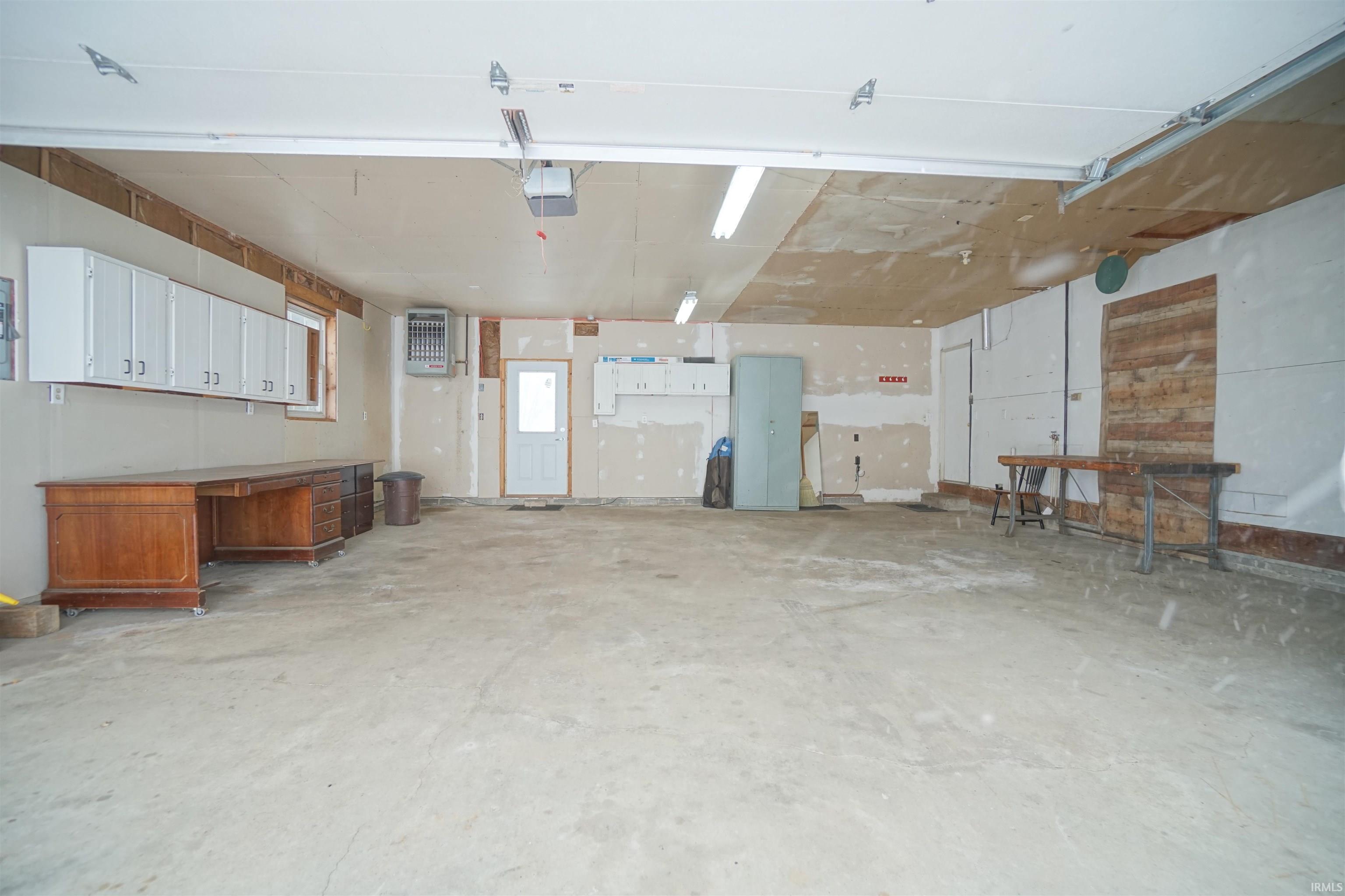 Heated Garage with storage cabinets included