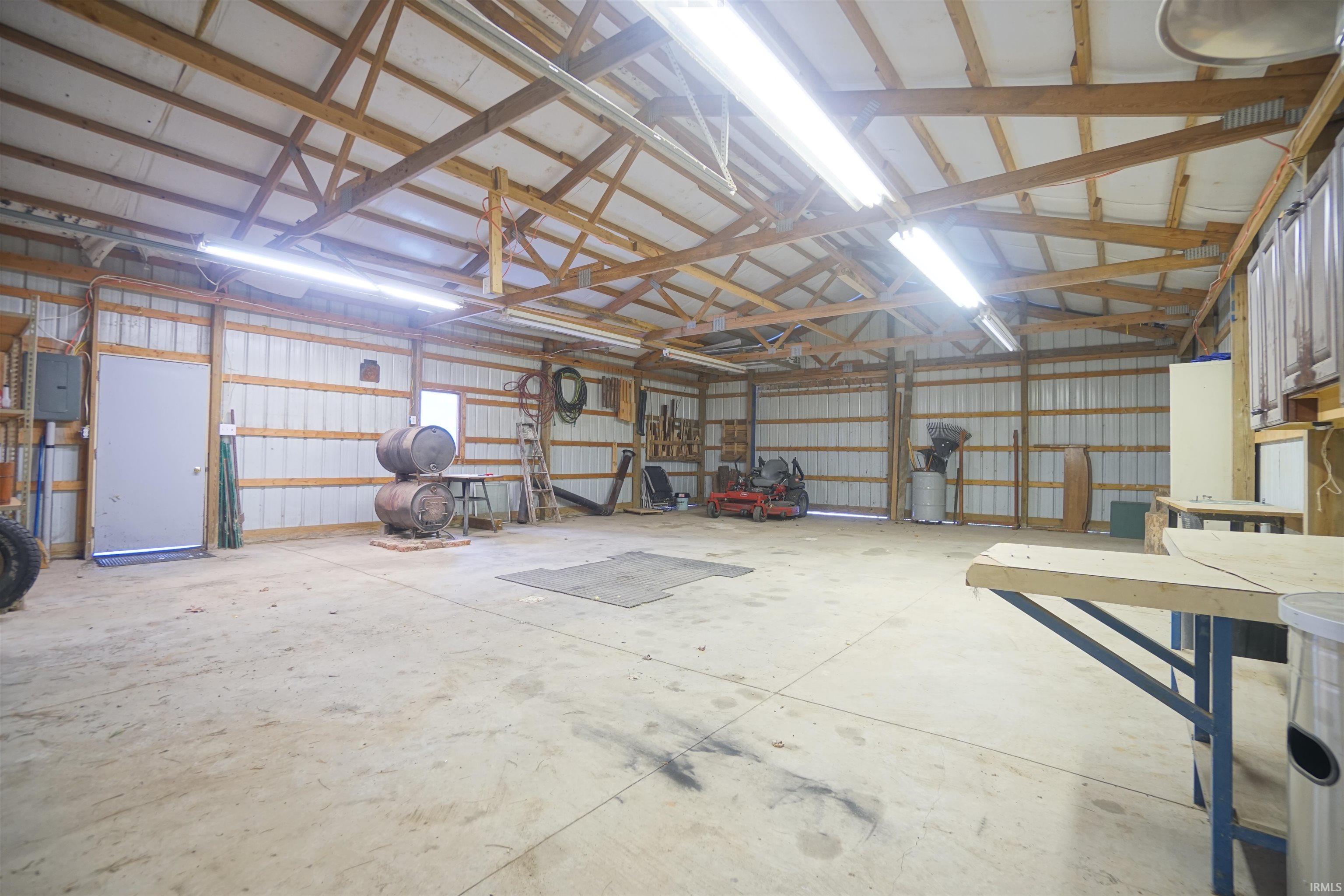 40' x 30' Pole Barn w/ 12' x 8' Overhead Door, 10' x 9' Slider Door, 100 amp Electric, Wood Burning Stove.