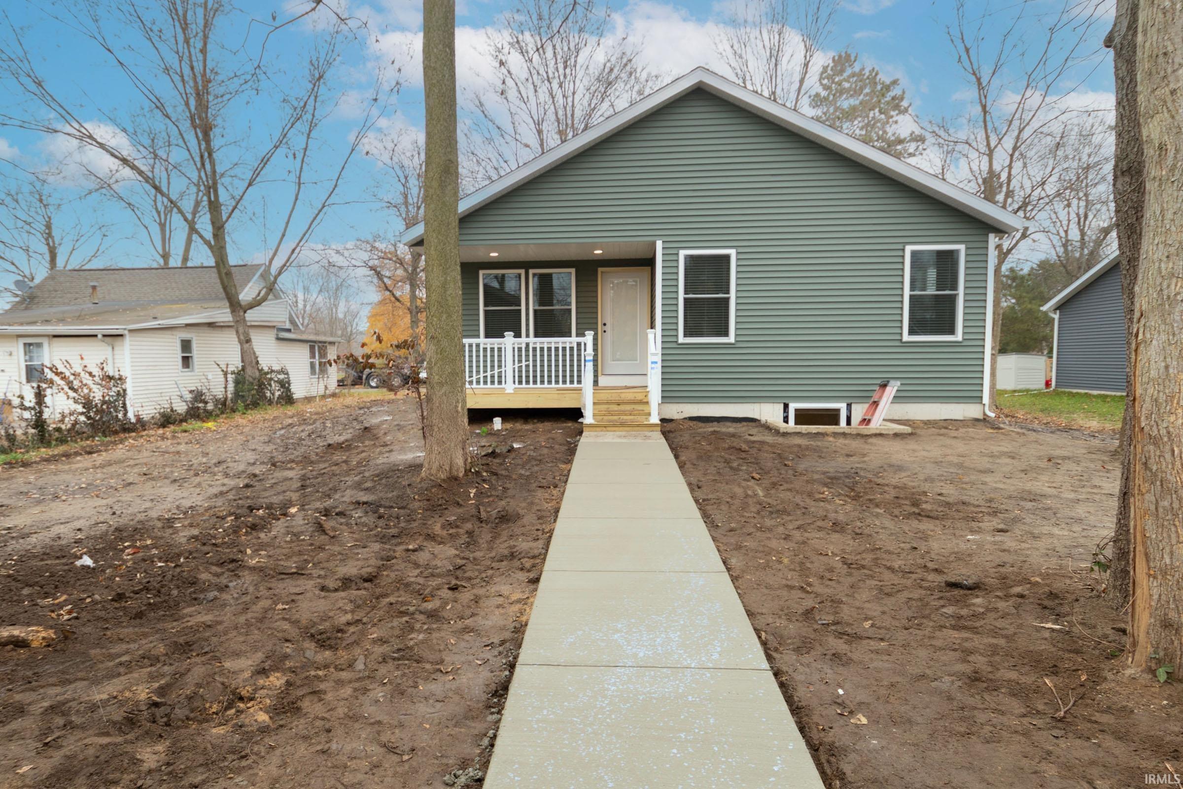 Bungalow-style house featuring covered porch
