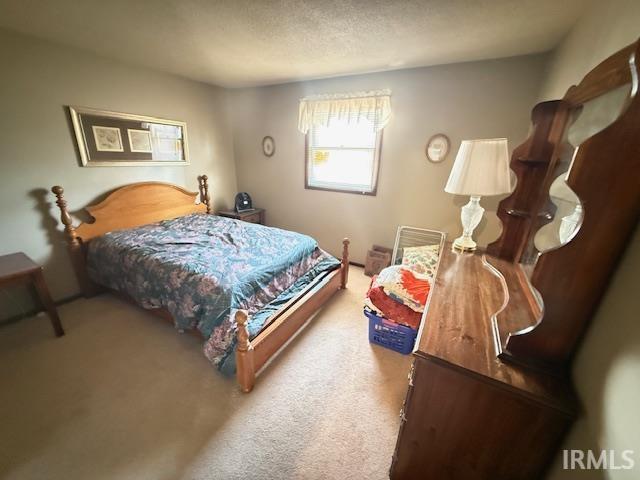 Bedroom featuring carpet