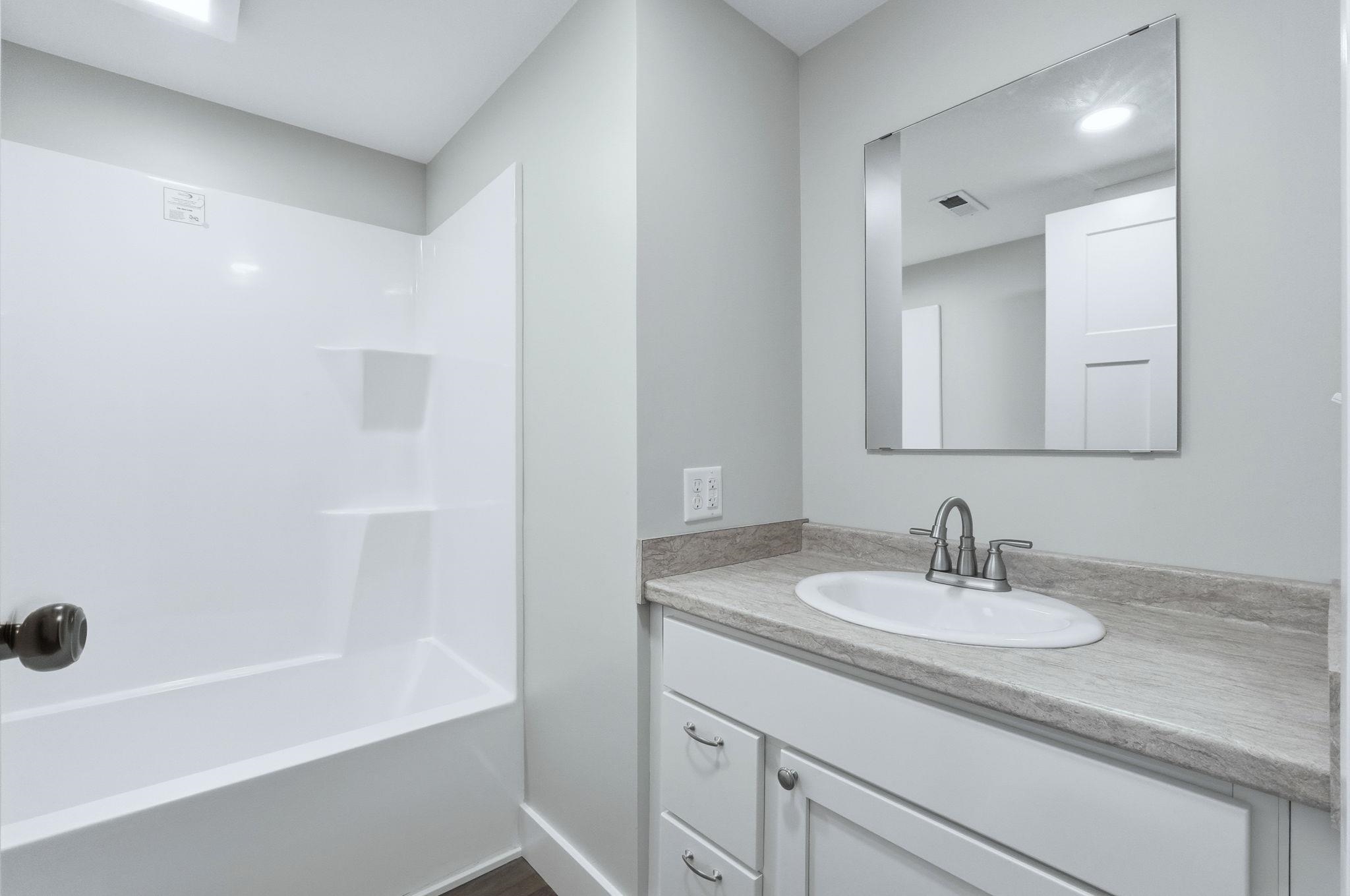 Bathroom with vanity and shower / bathtub combination
