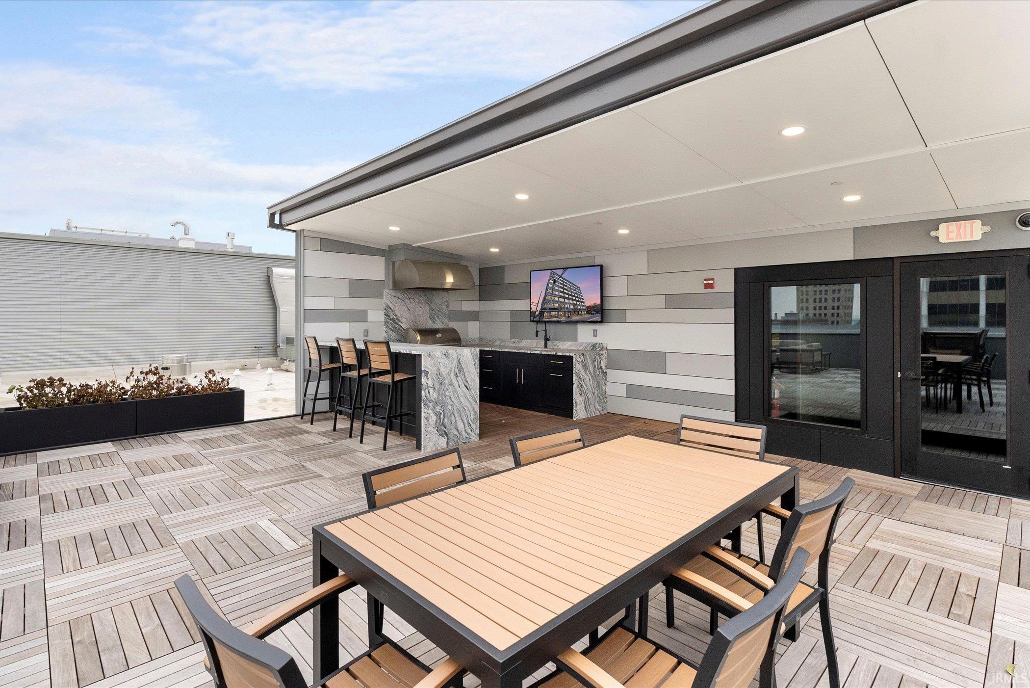 View of patio with outdoor dining area