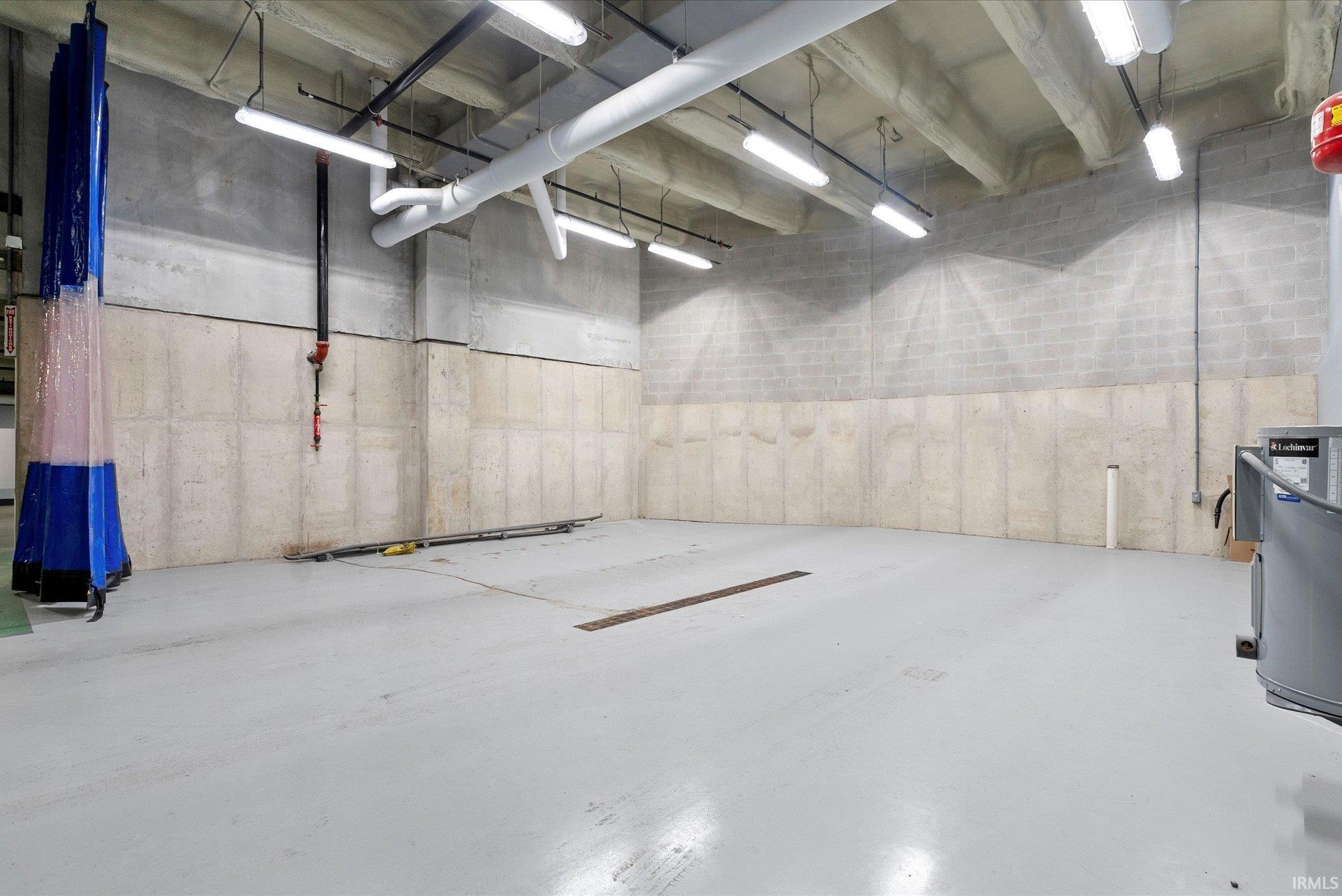 Garage featuring water heater