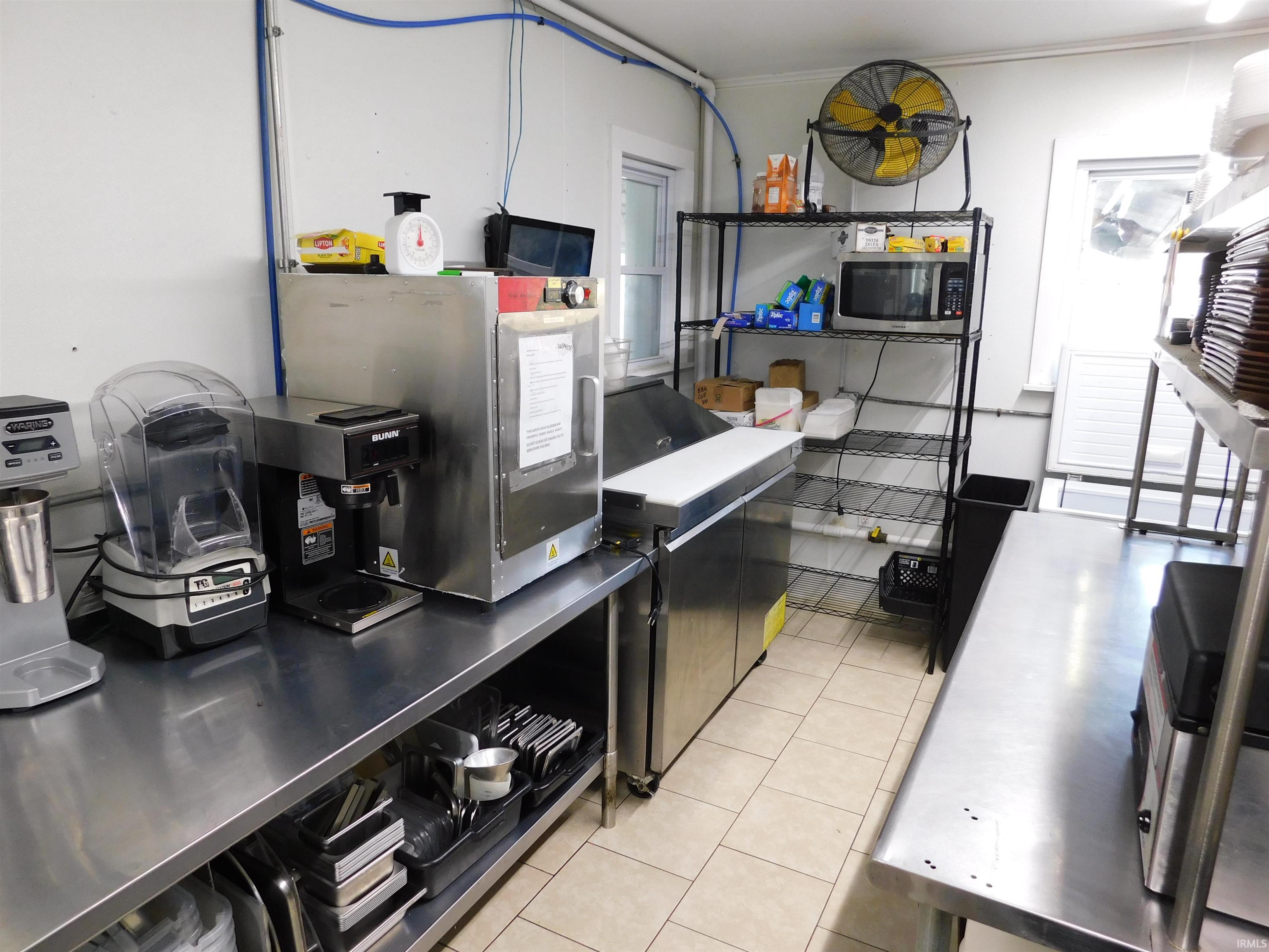Kitchen with stainless steel microwave