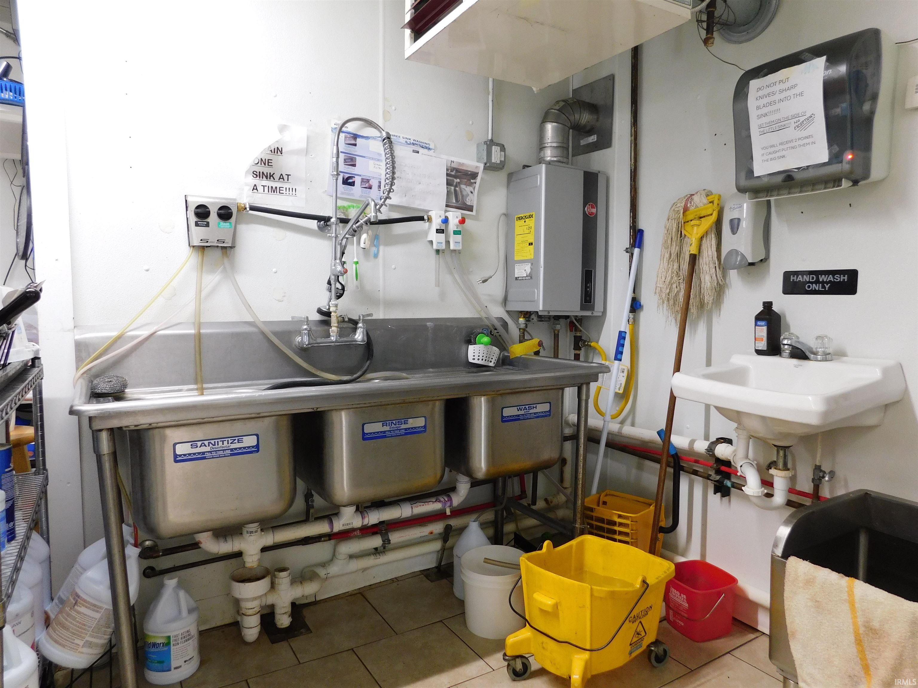 Utilities with a sink and tankless water heater