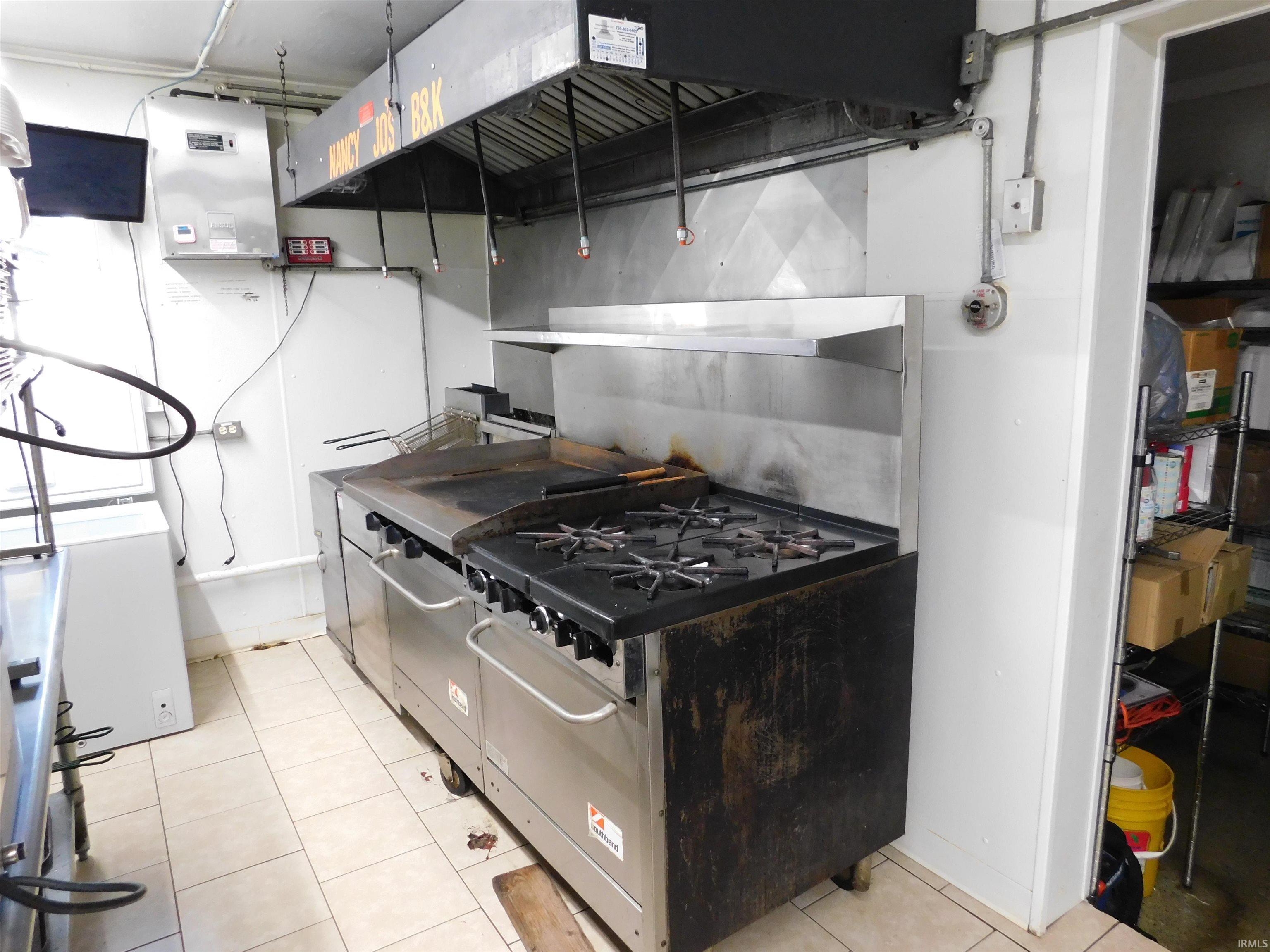Kitchen featuring light tile patterned floors