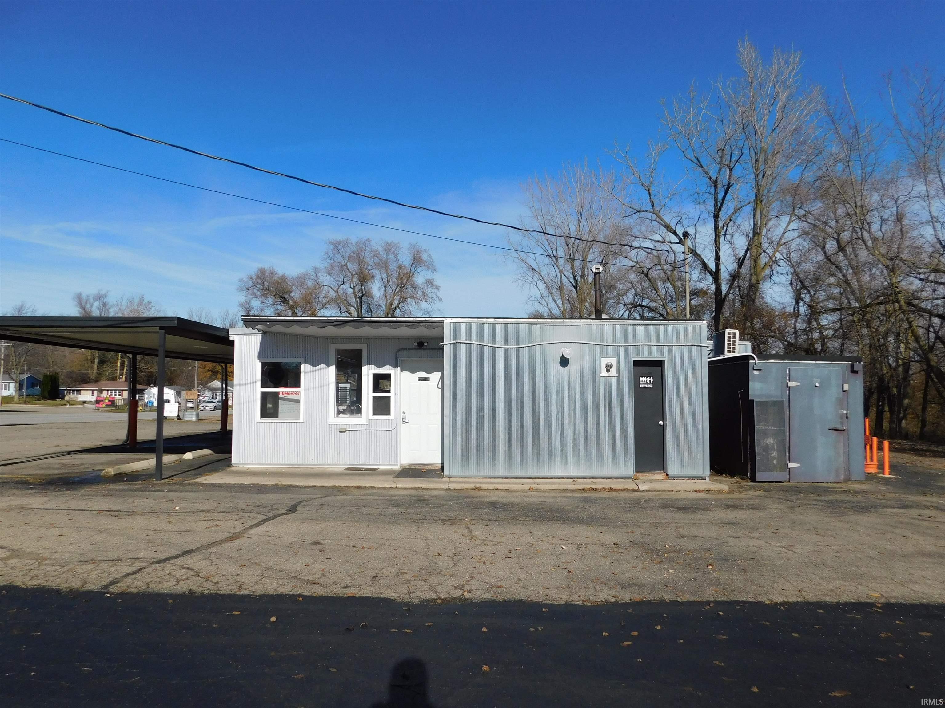 Garage featuring a carport