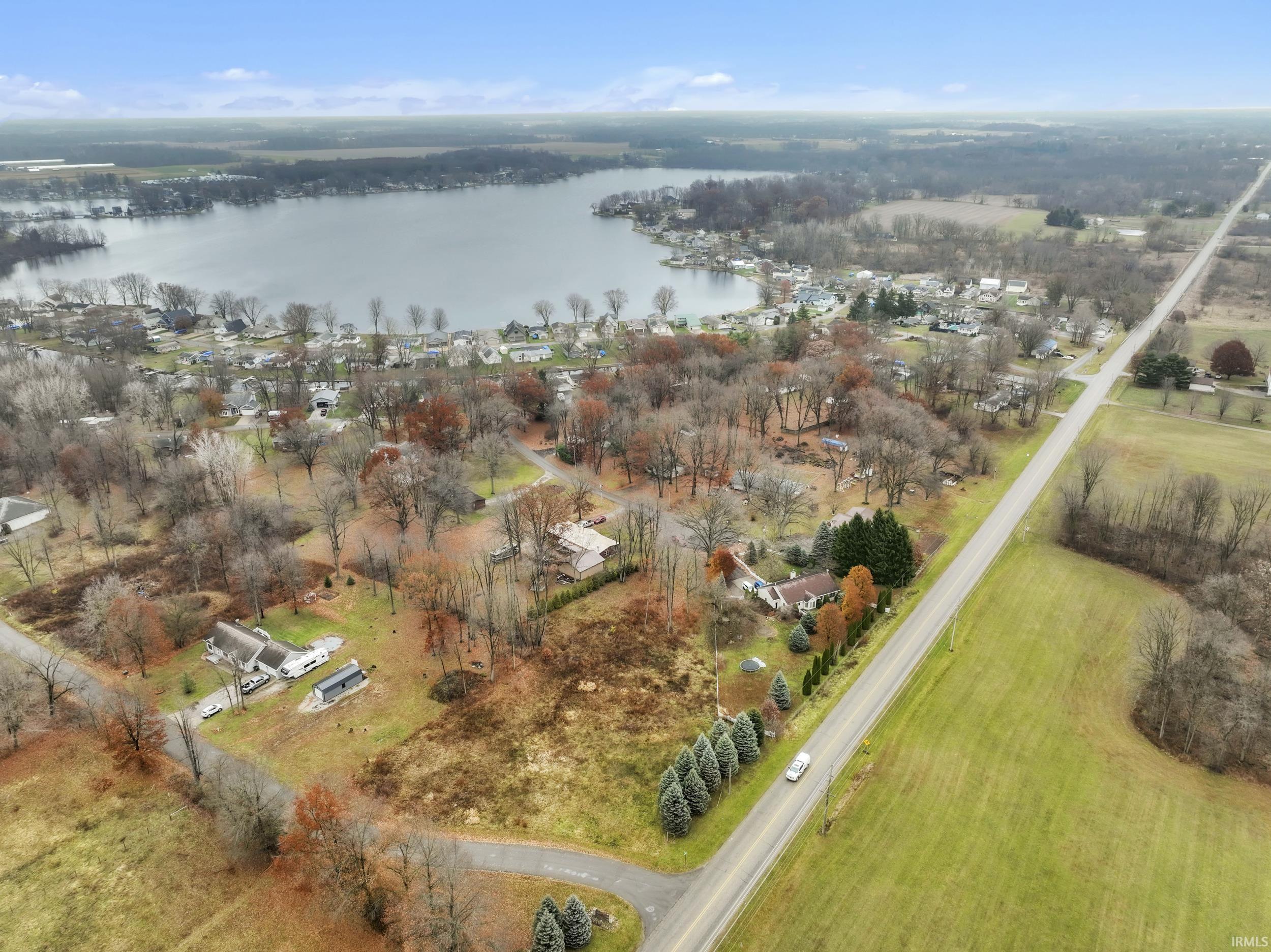 Aerial view of property's location featuring a nearby body of water