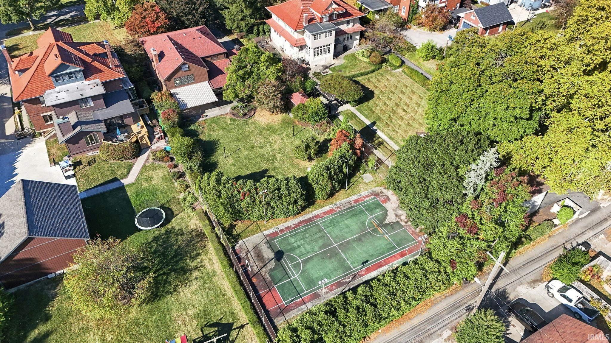 Aerial view of property's location with nearby suburban area