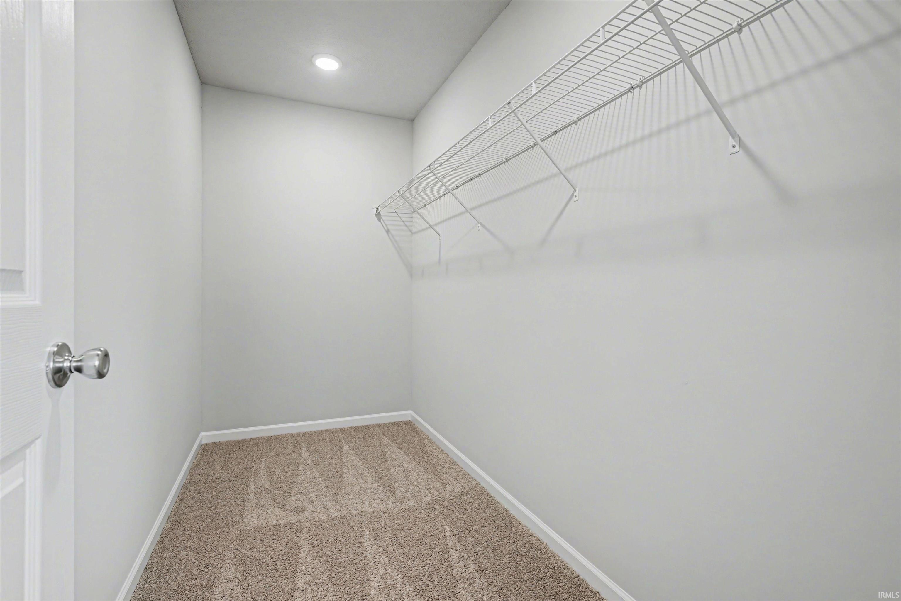 The primary suite features an oversized walk in closet