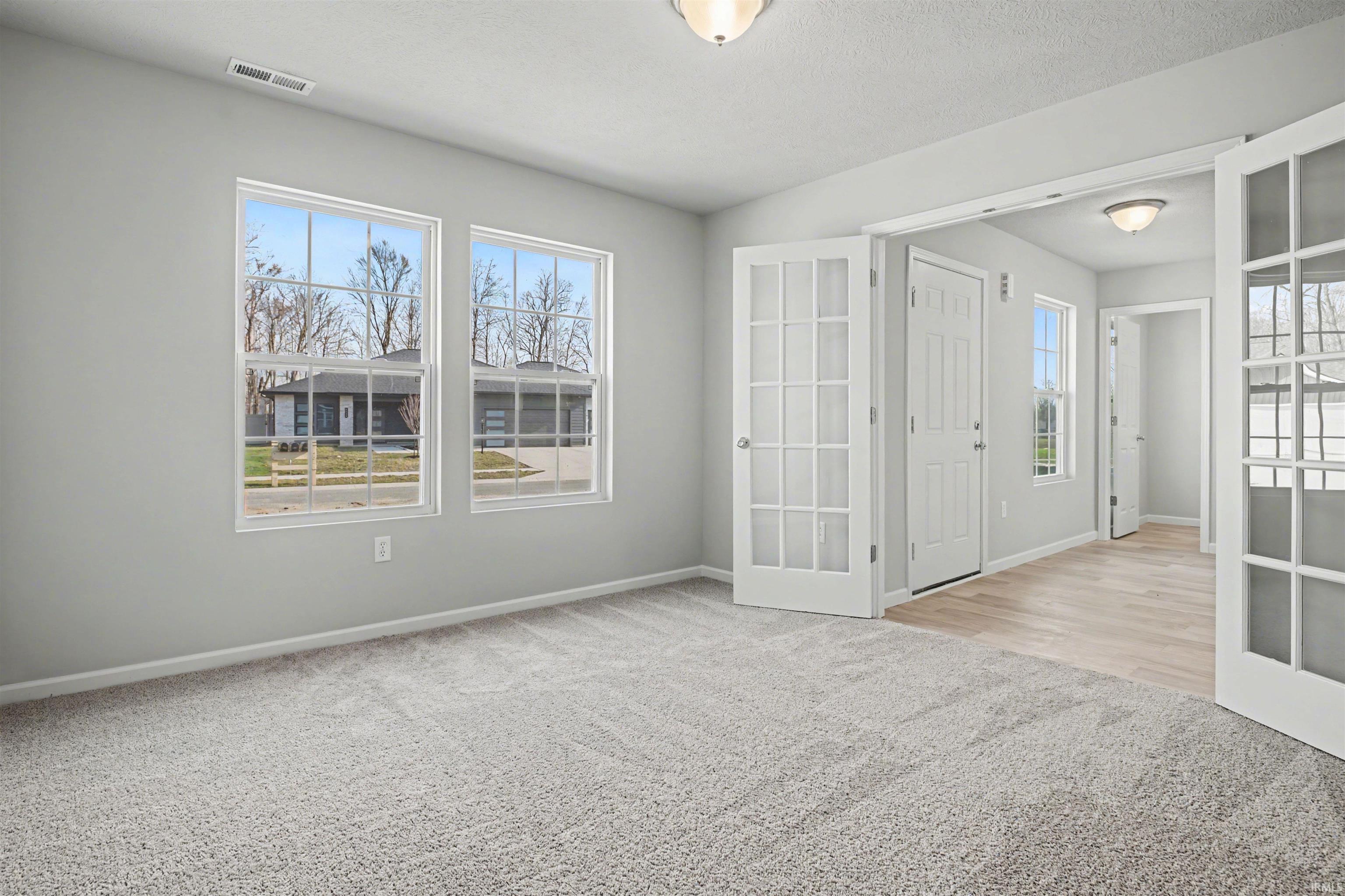 The den has ample lighting, French door entry and would make an ideal office or study room.