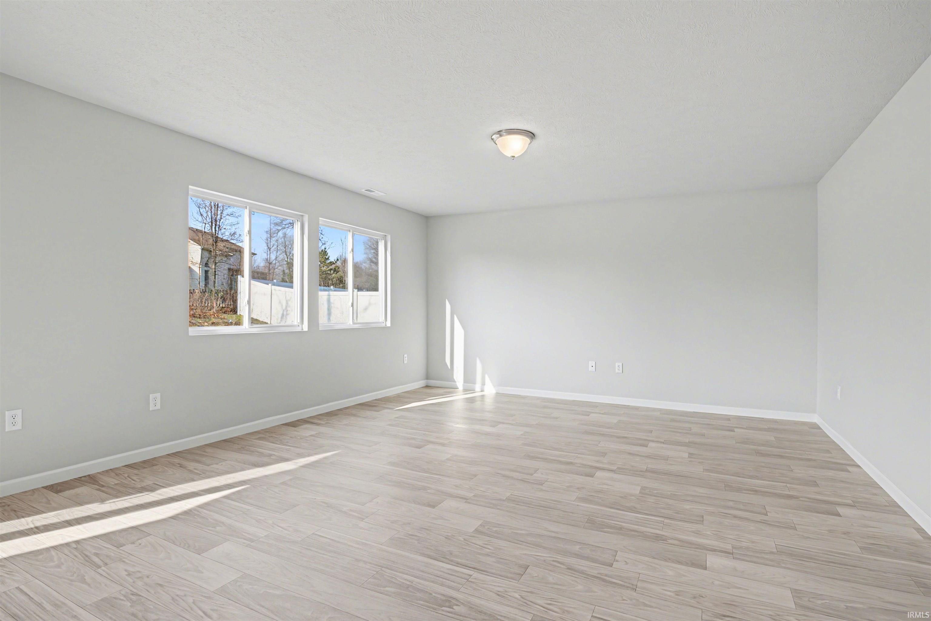 The great room features an abundance of natural lighting and offers open sight lines into the kitchen – perfect for entertaining groups routine activities and functionality.