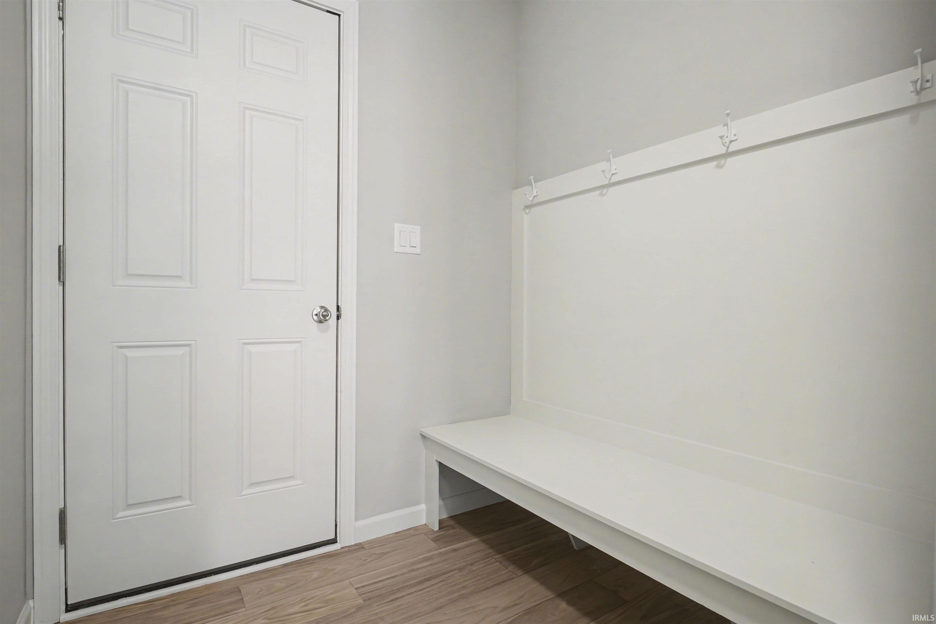 The mudroom includes a large storage close and access to the garage.