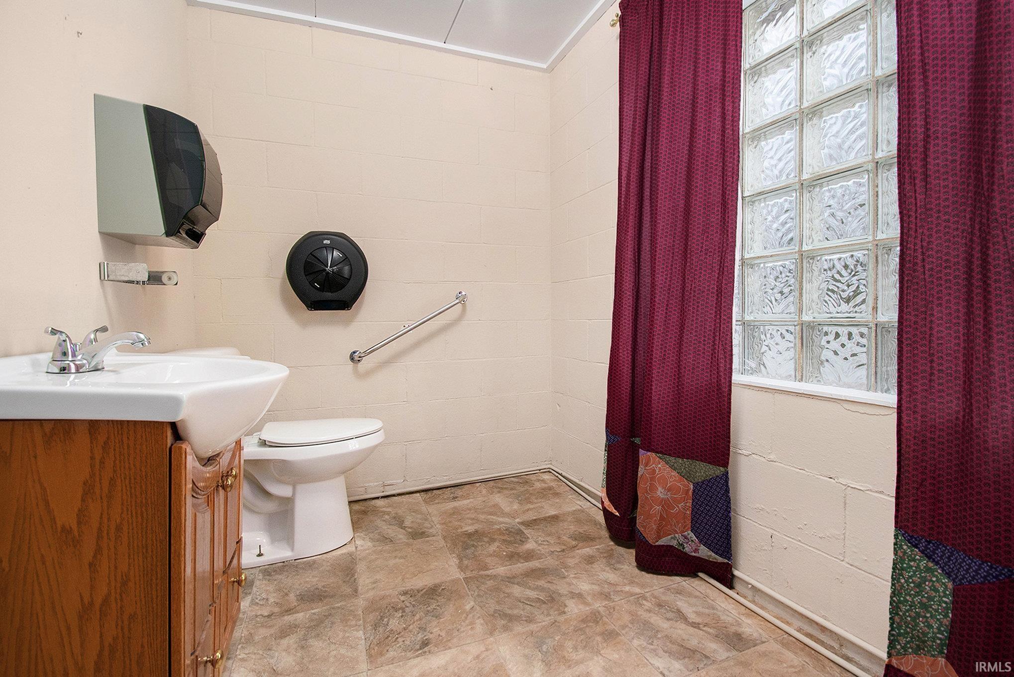 Full bathroom with vanity and toilet