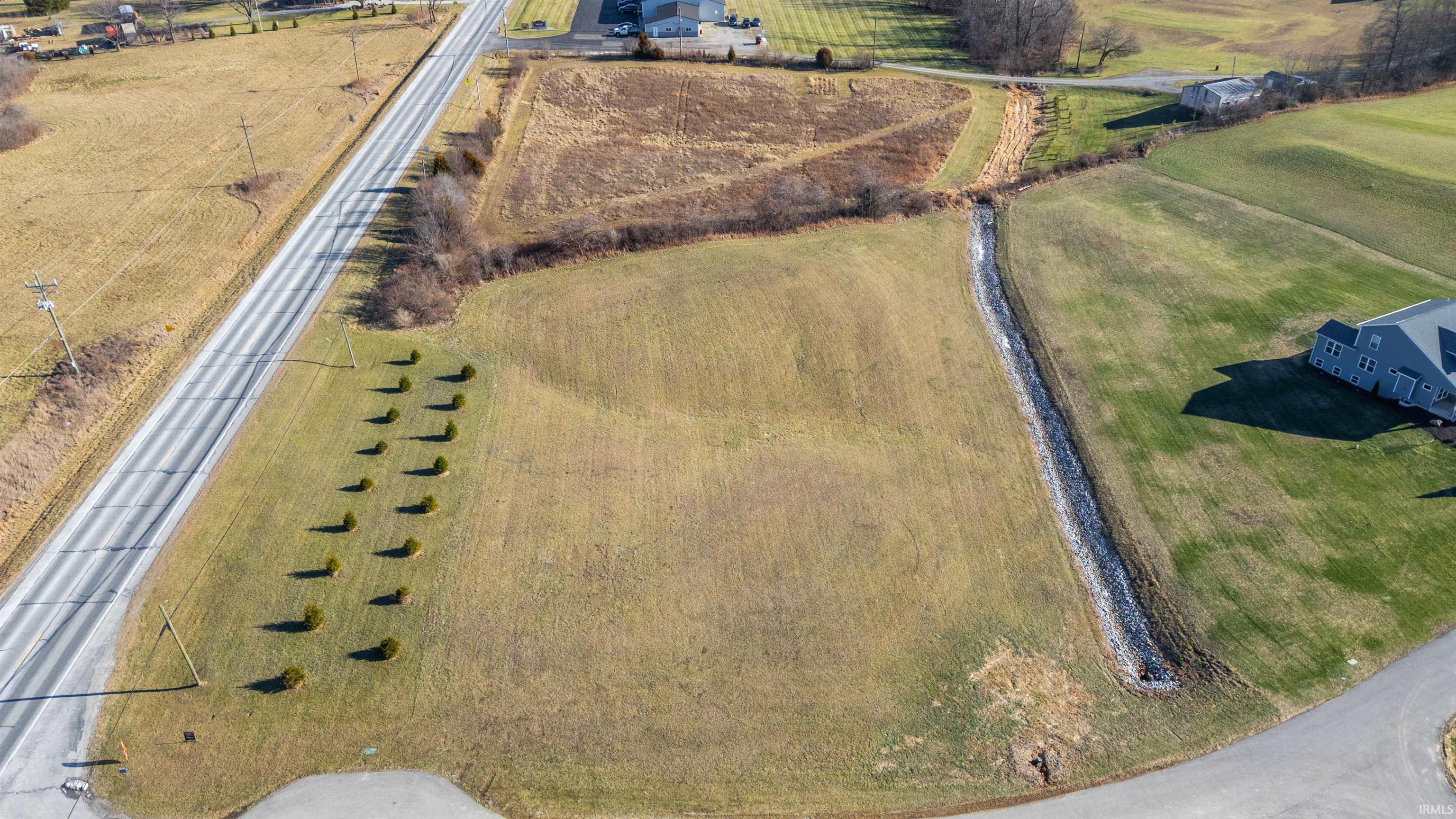 Aerial view of property and surrounding area with rural landscape