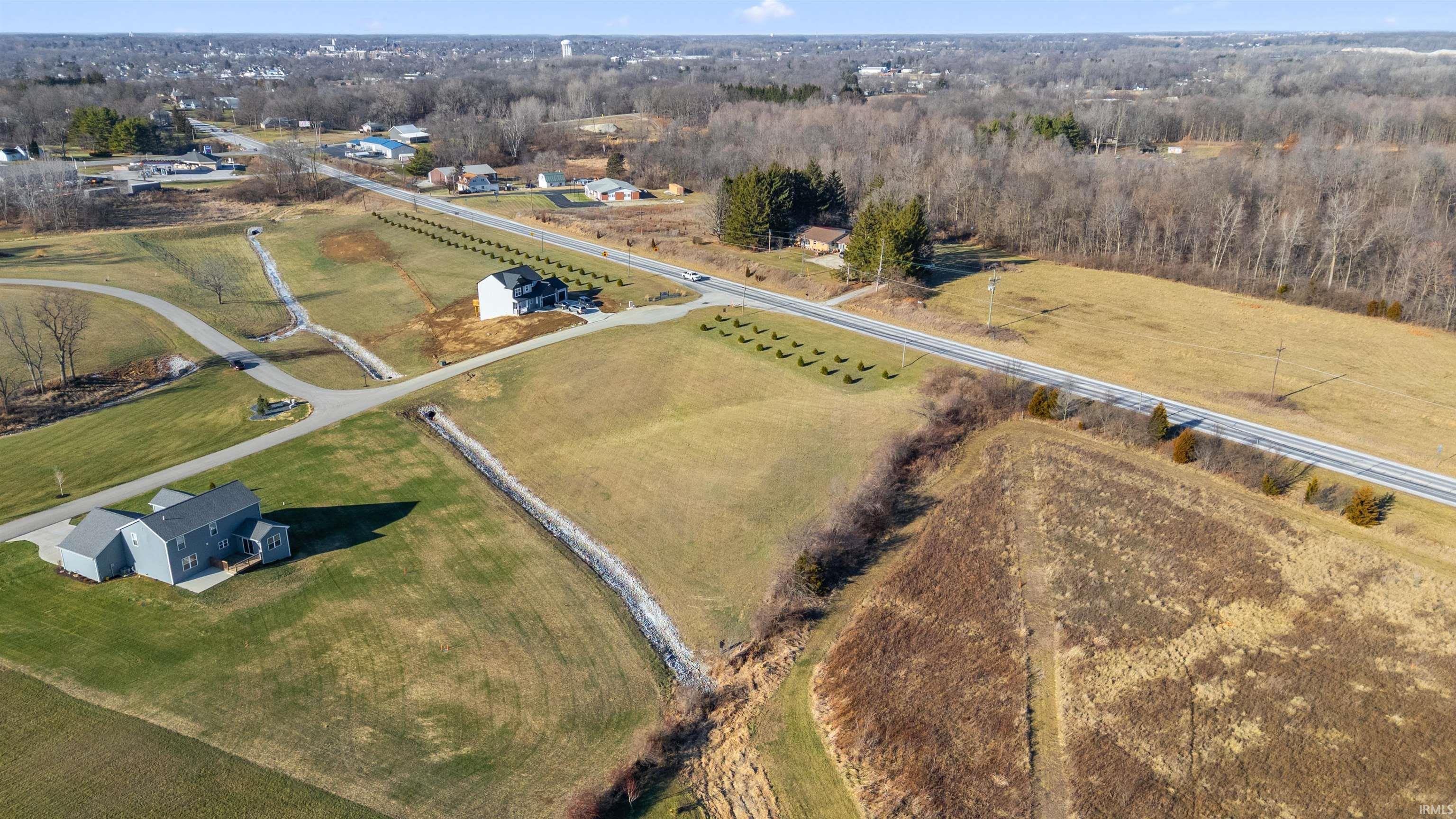 Aerial view of property and surrounding area with rural landscape