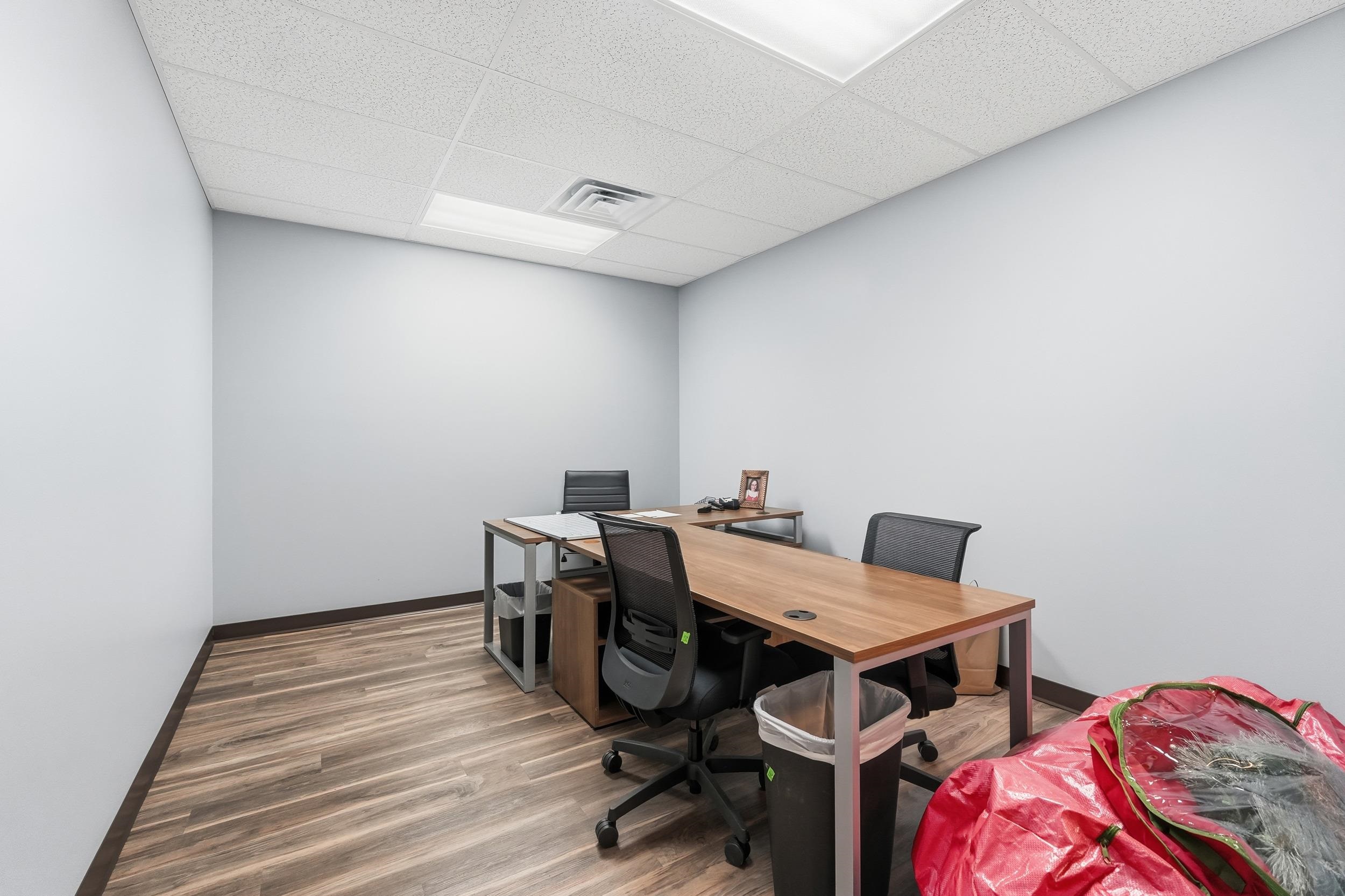 Office featuring a drop ceiling