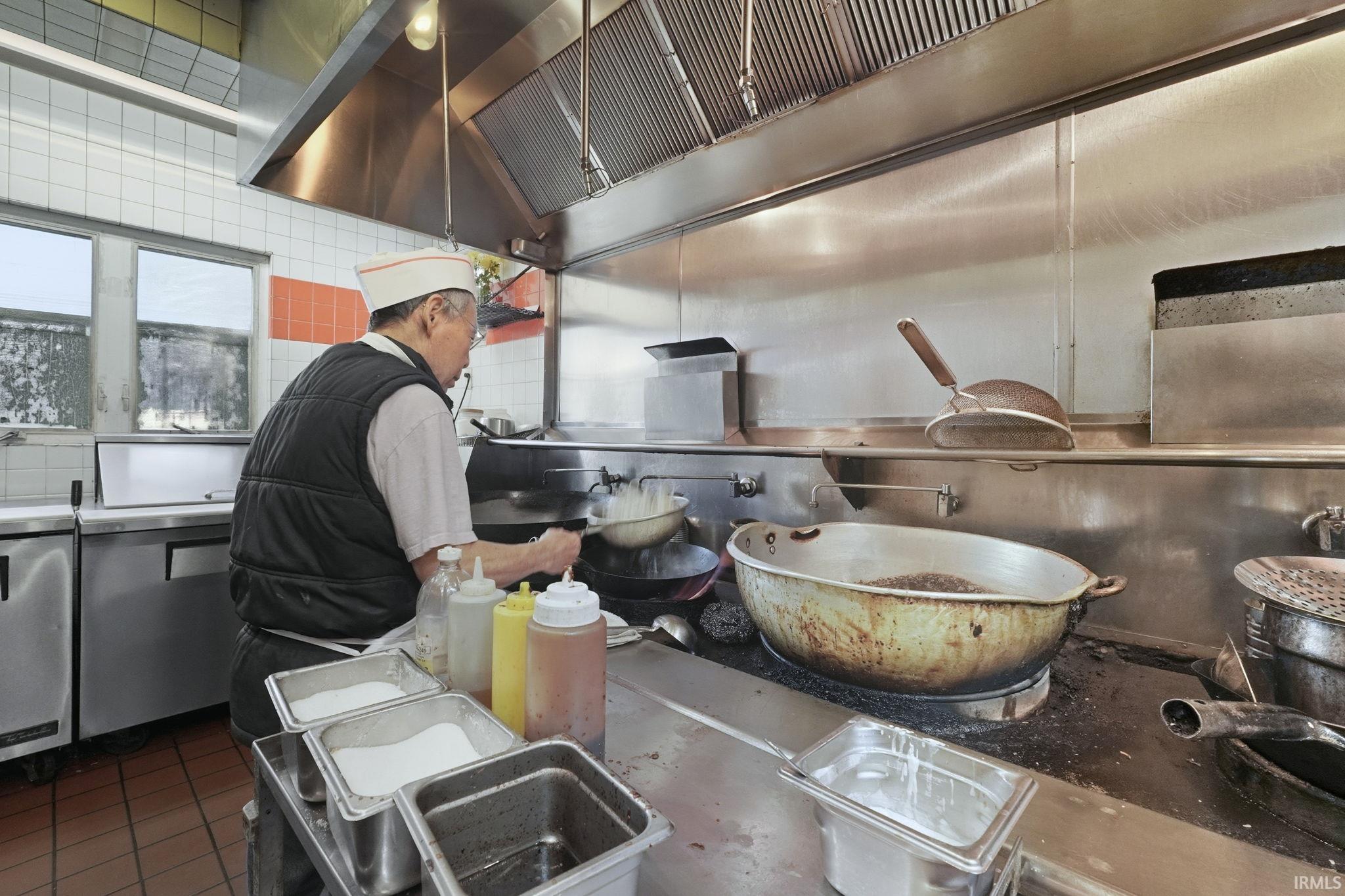 Kitchen view of under cabinet range hood
