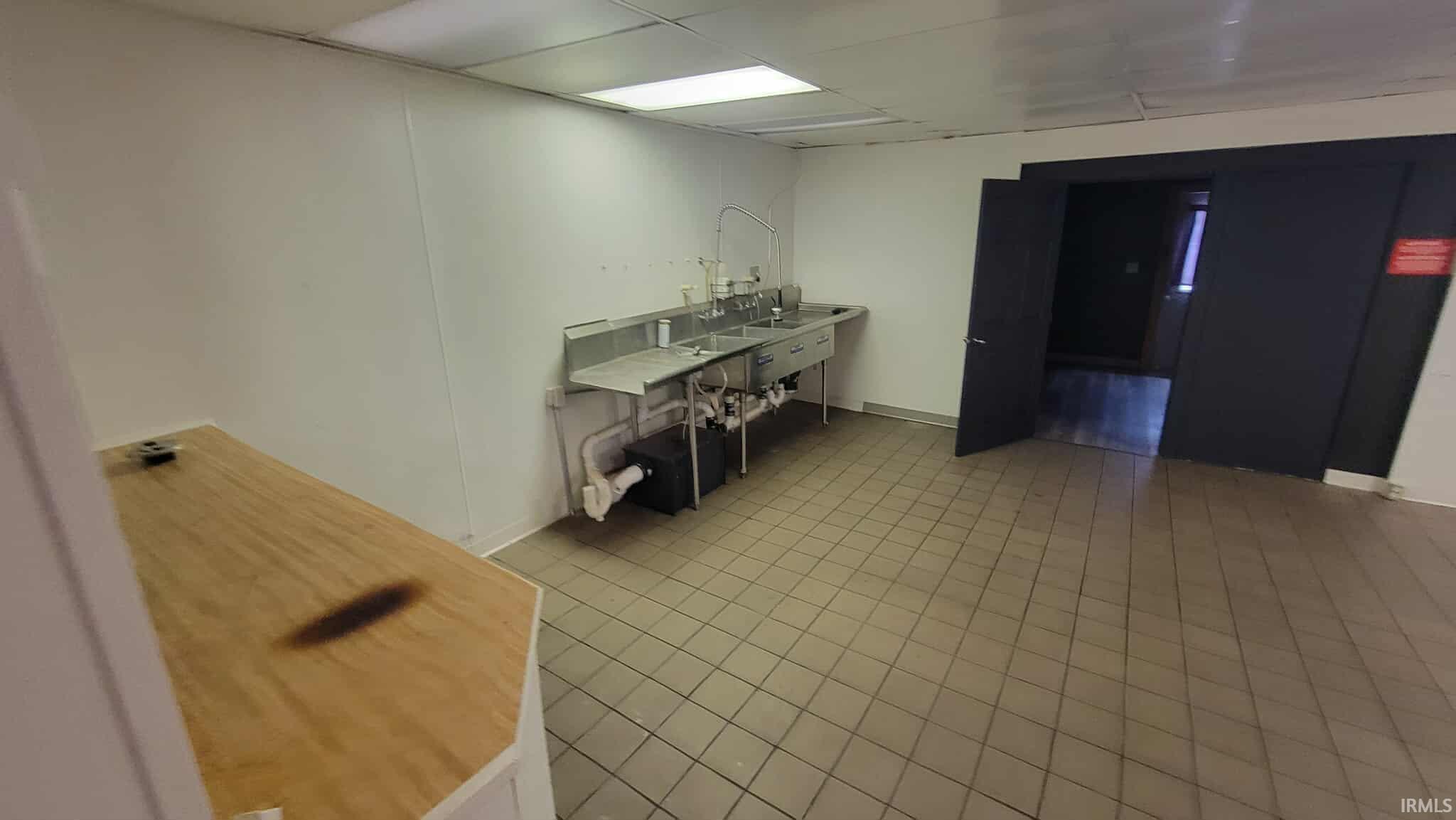 Washroom featuring a paneled ceiling