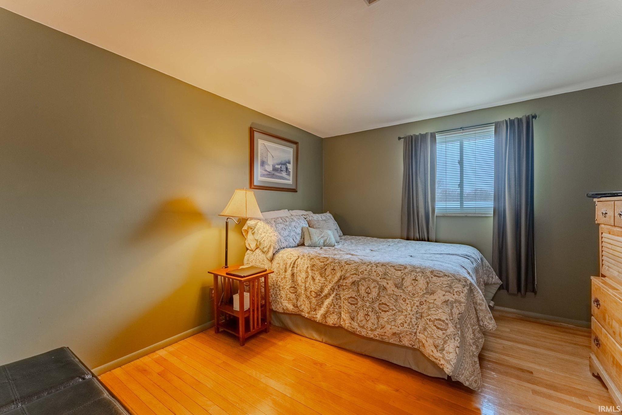 Bedroom with light wood-style flooring