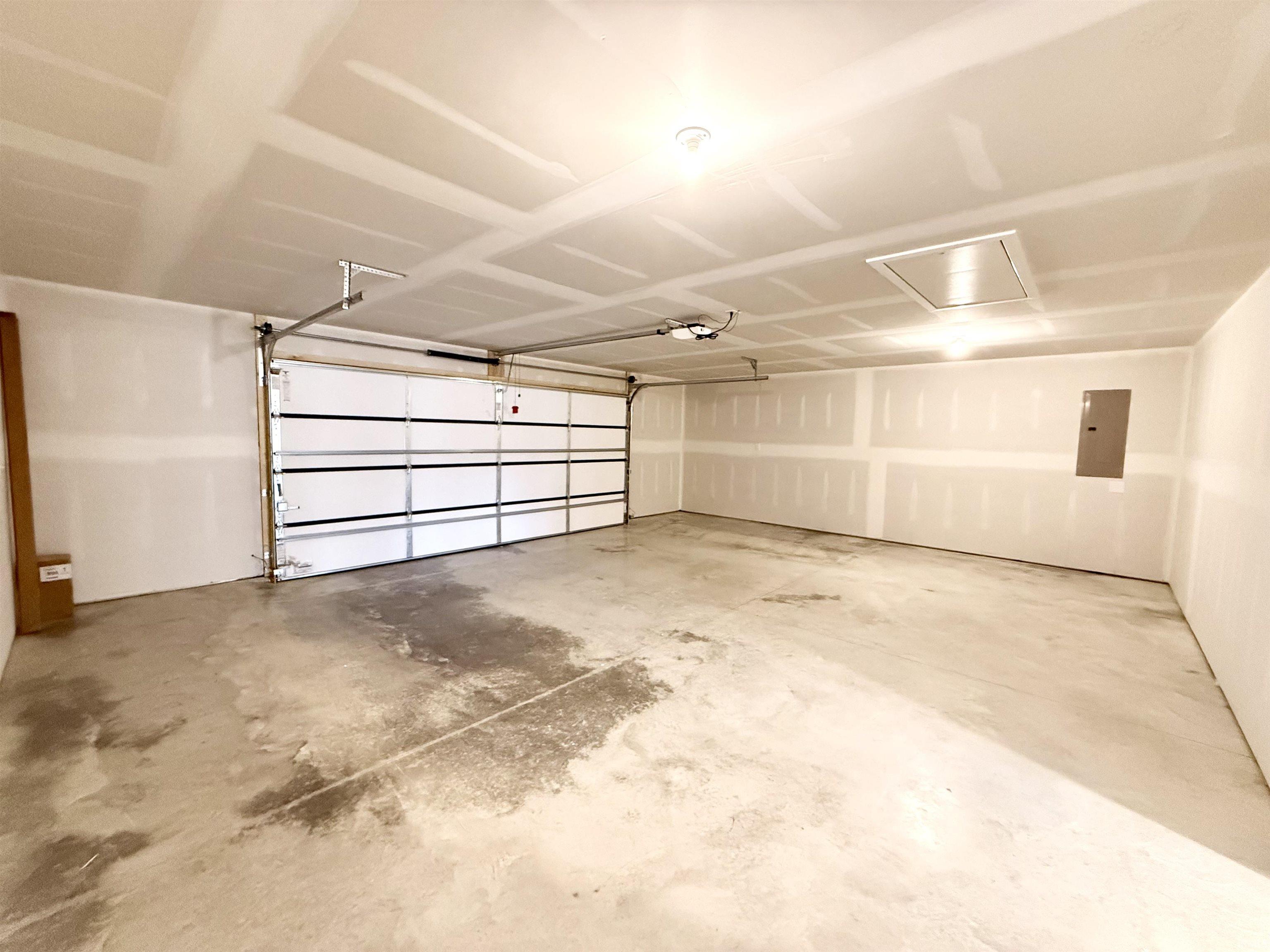 Garage featuring electric panel