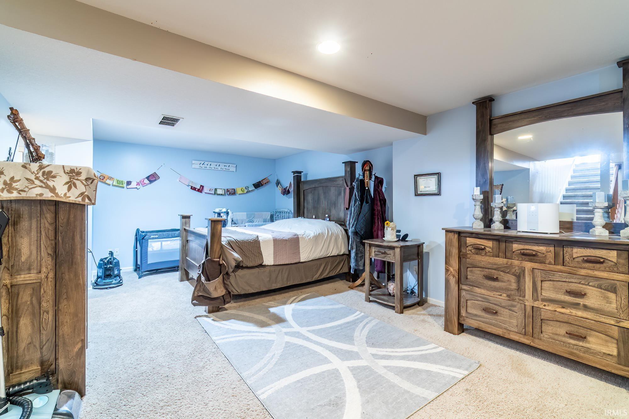 Bedroom with light carpet