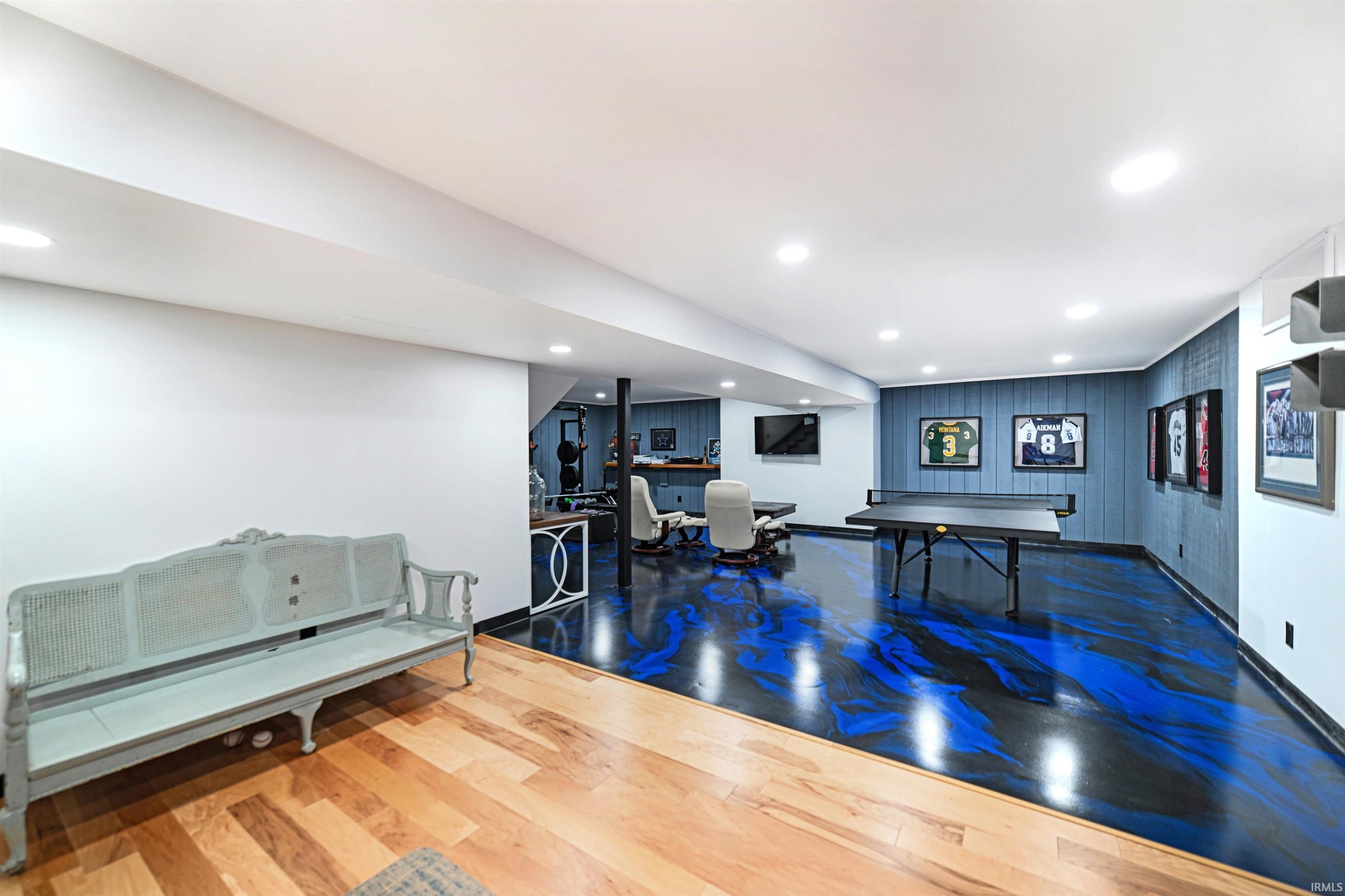 Playroom with wood finished floors and recessed lighting