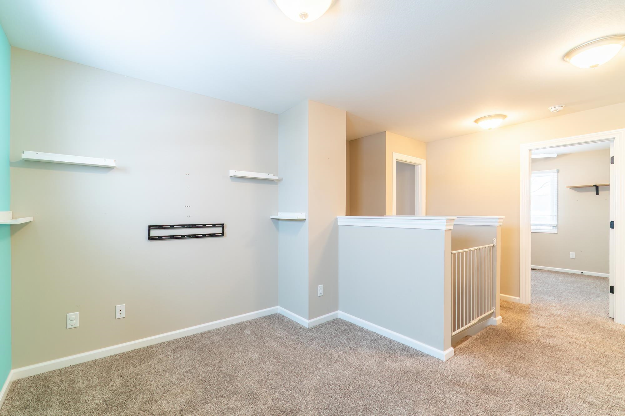 Unfurnished room with carpet flooring and baseboards