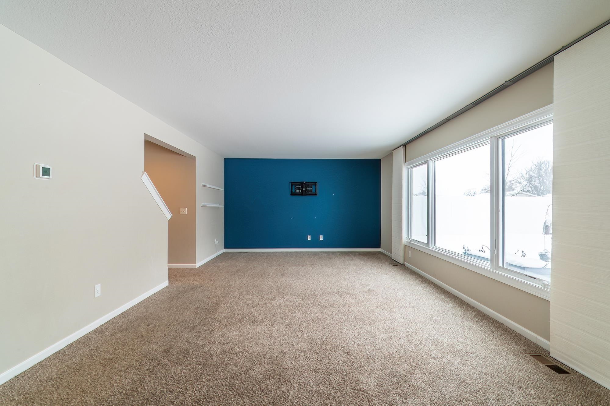 Spare room with carpet flooring and baseboards