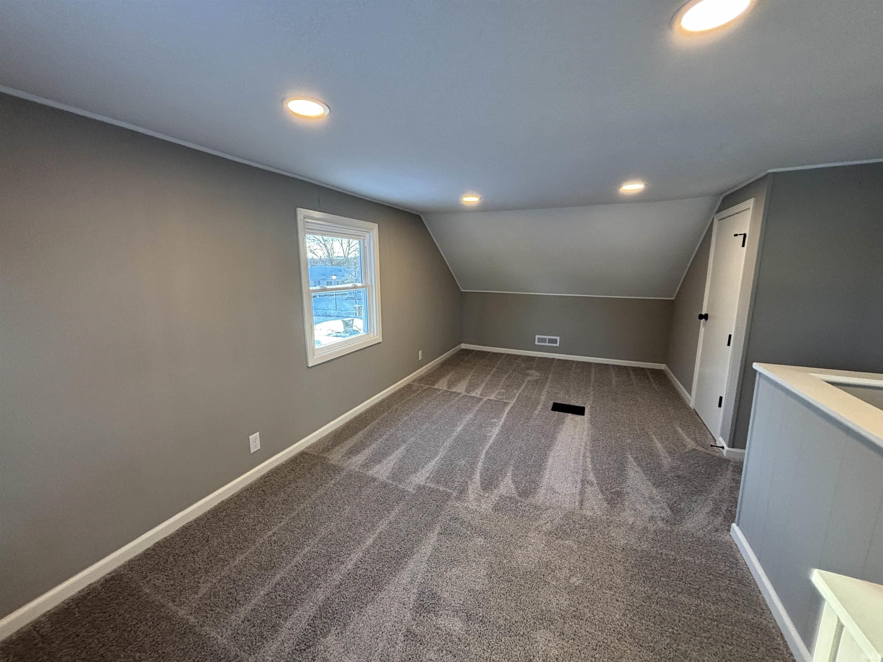 Bonus room featuring carpet flooring, recessed lighting, and vaulted ceiling